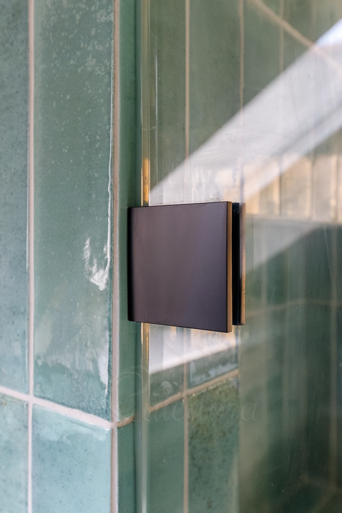 Black PVD coated shower wall bracket showing advanced coating finish precision