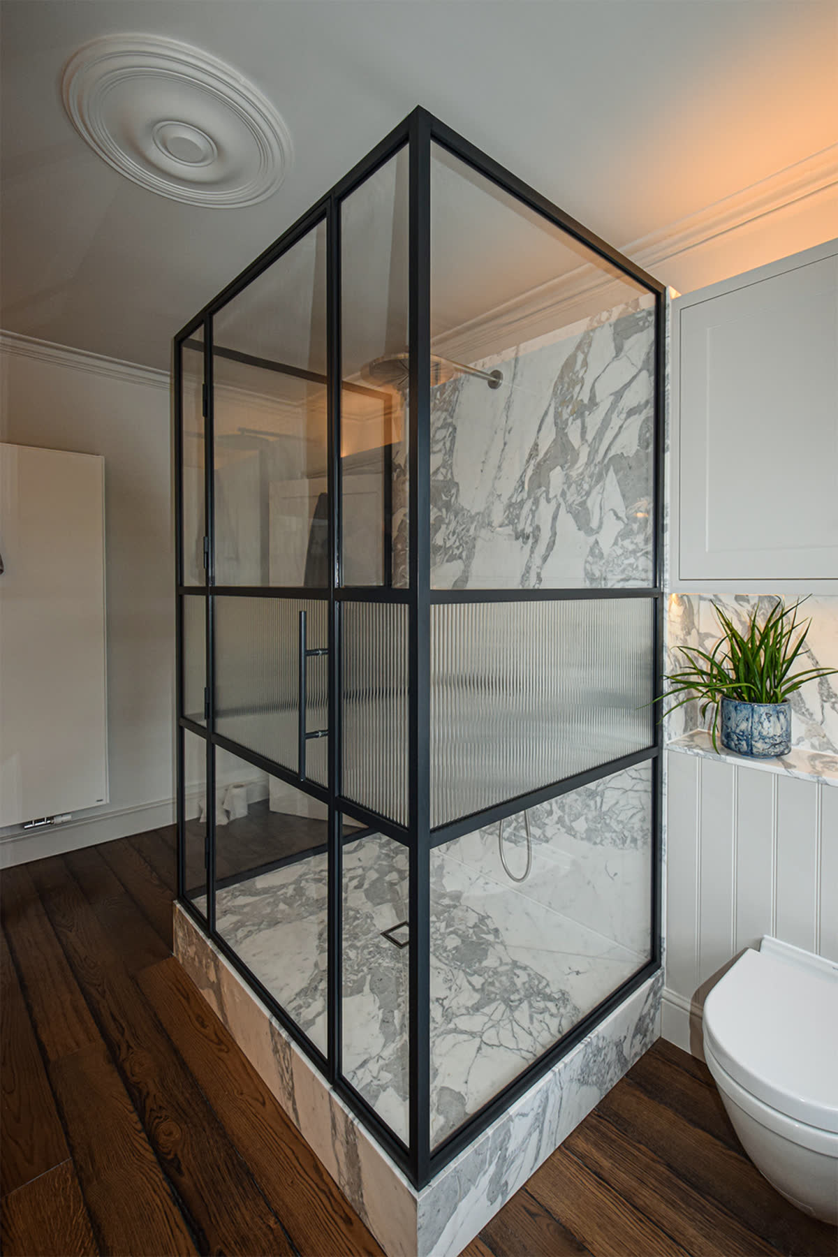 bespoke frame three sided shower enclosure with reeded glass