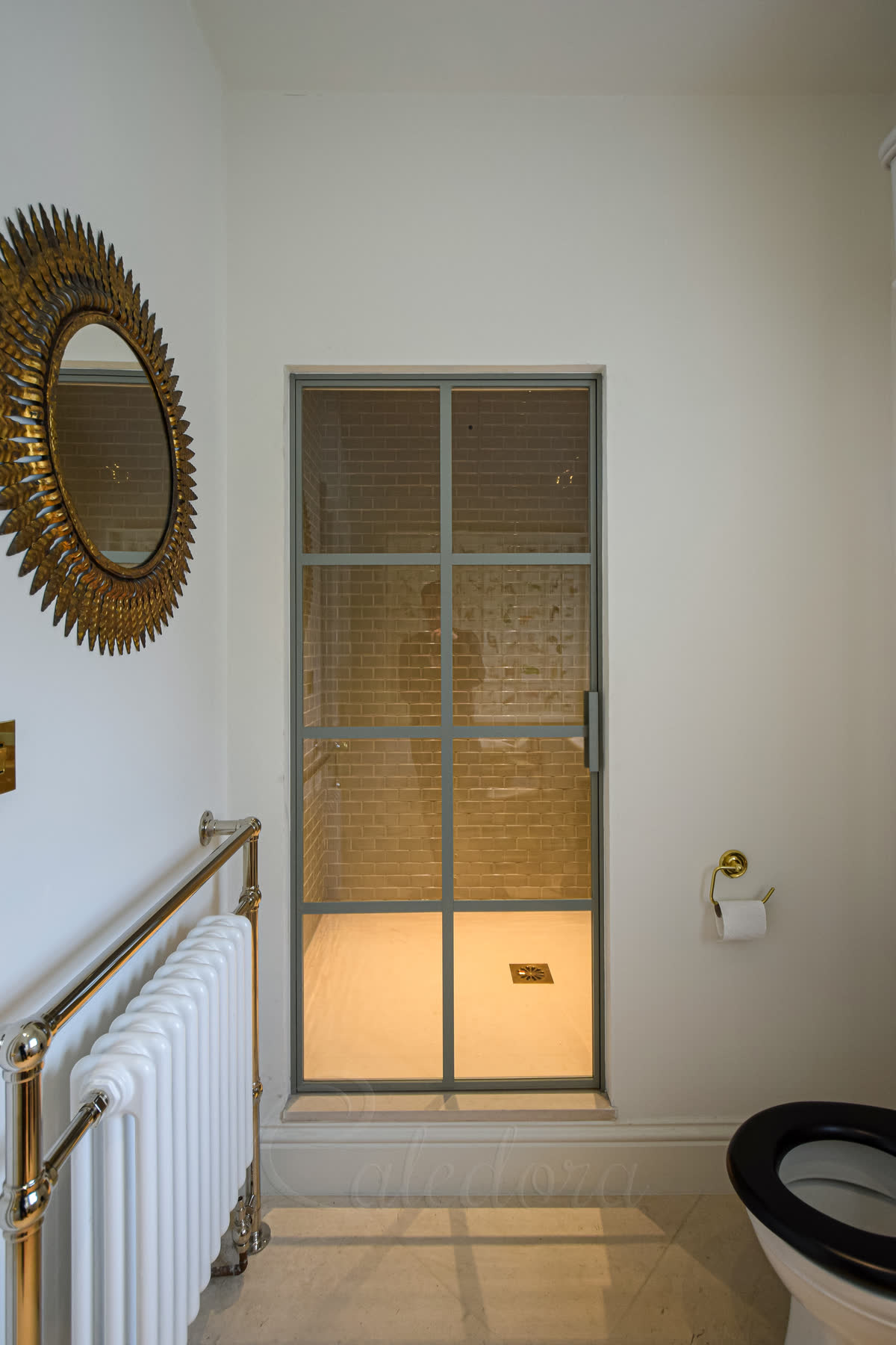 Bespoke shower door with grid design, light grey powder coated finish in modern bathroom
