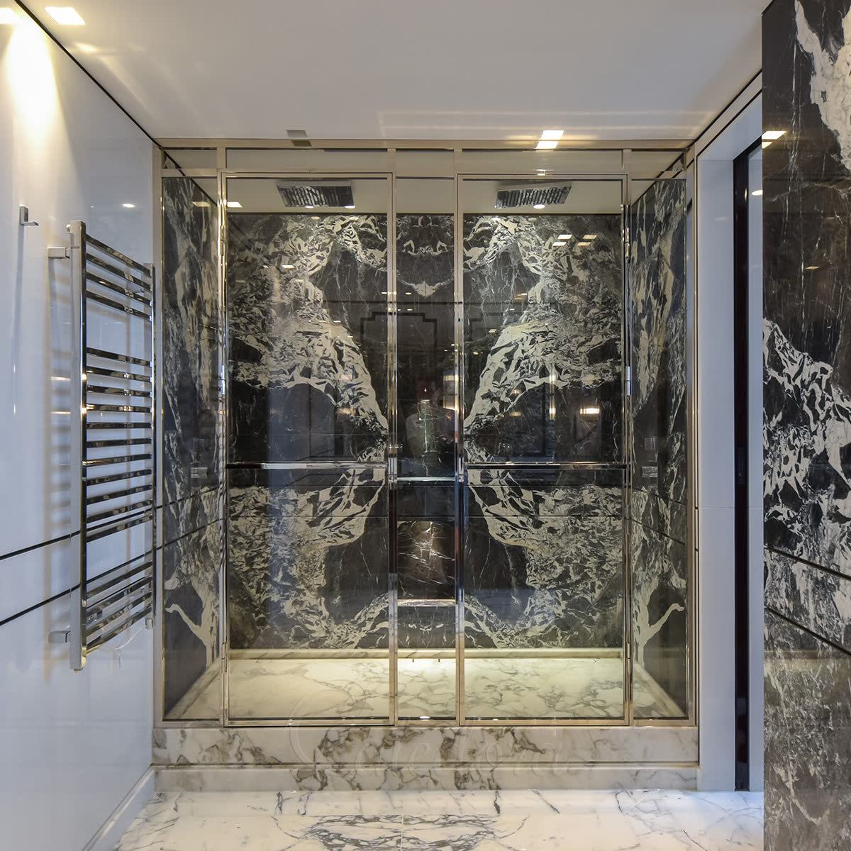 Bespoke shower enclosure with polished nickel double doors and full-height frameless glass