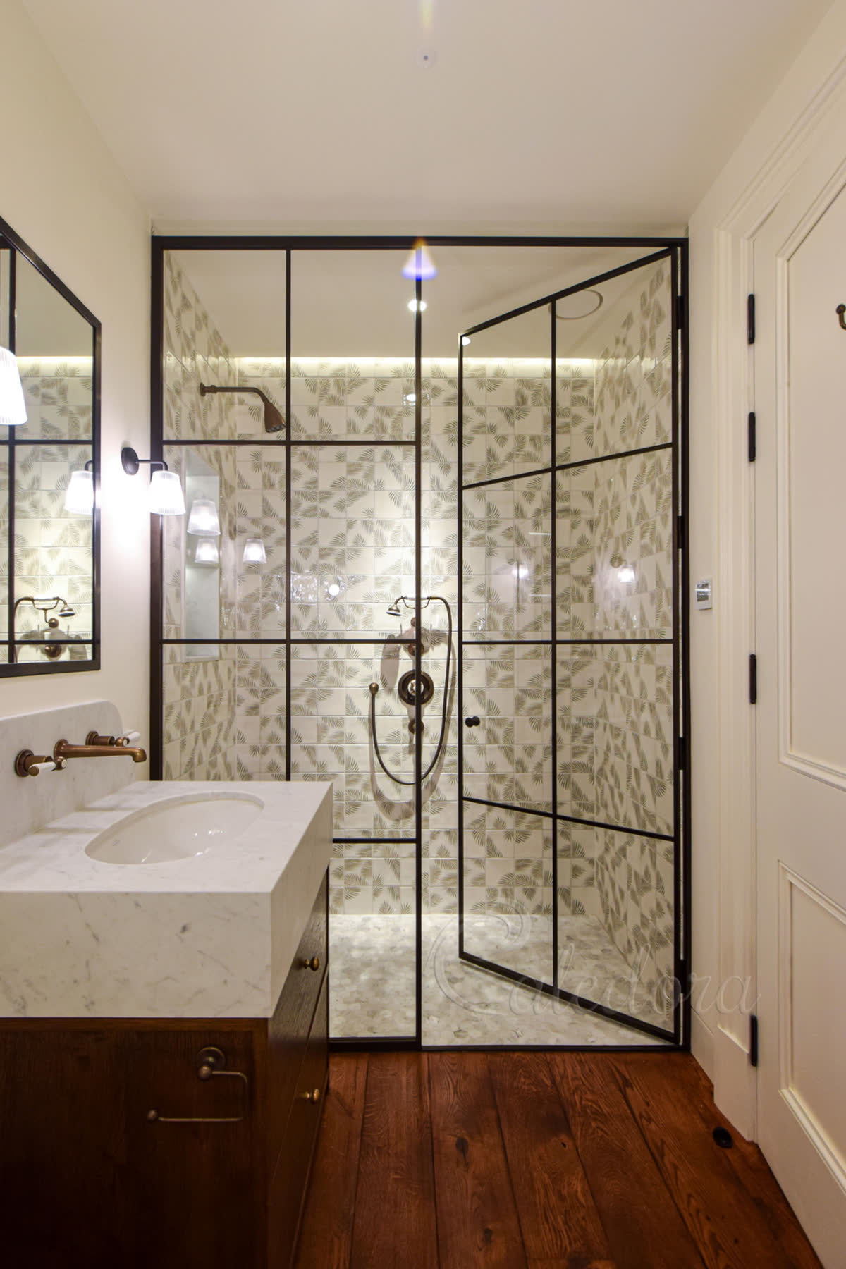shower screen and a door in industrial style with bronze frame