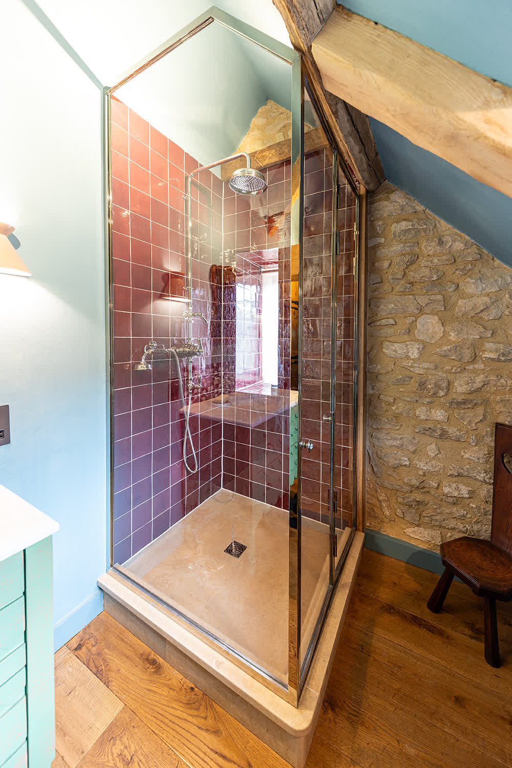 nickel framed enclosure installed under eaves with bifold doors