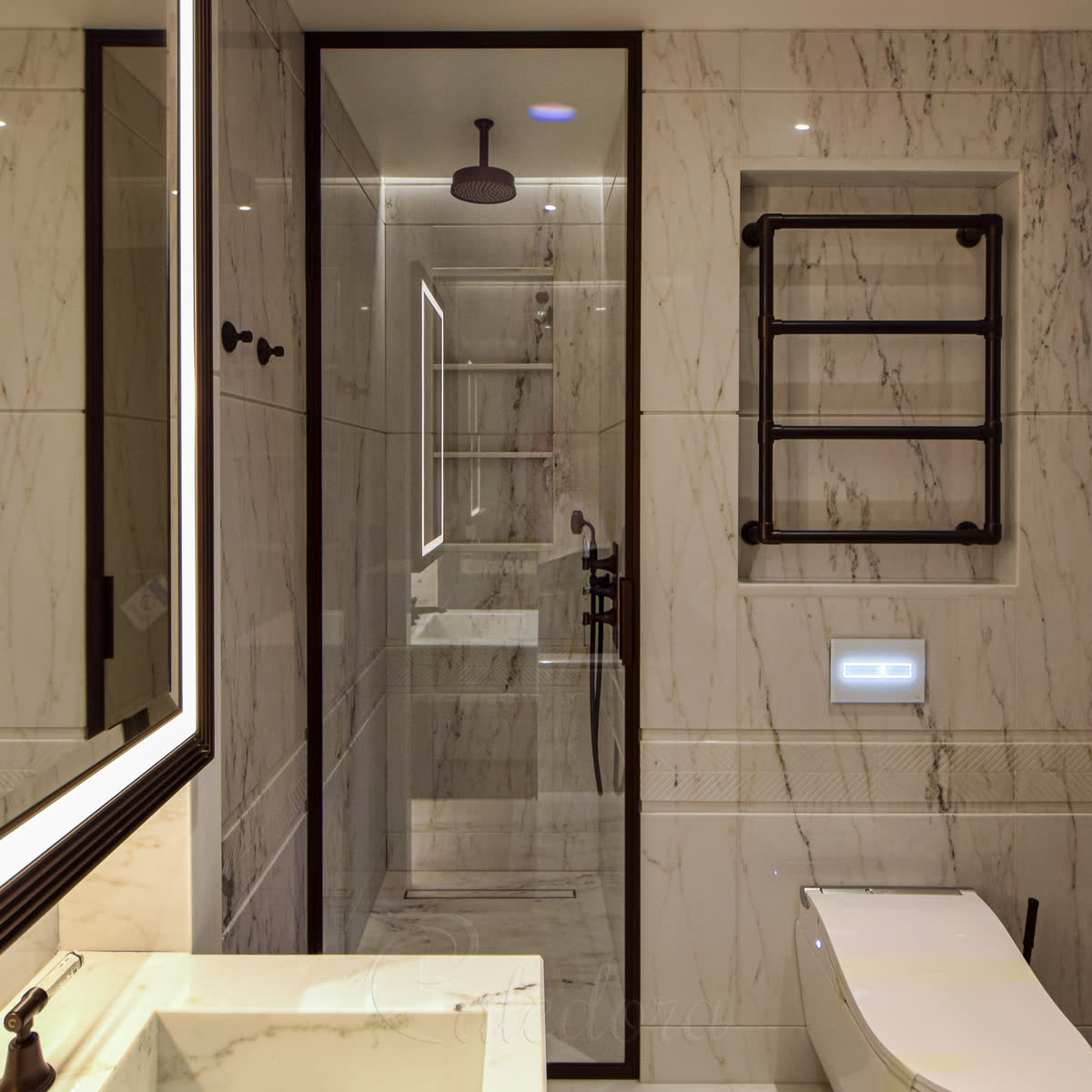 Bronze-frame shower glass door with full-height single panel in a London bathroom