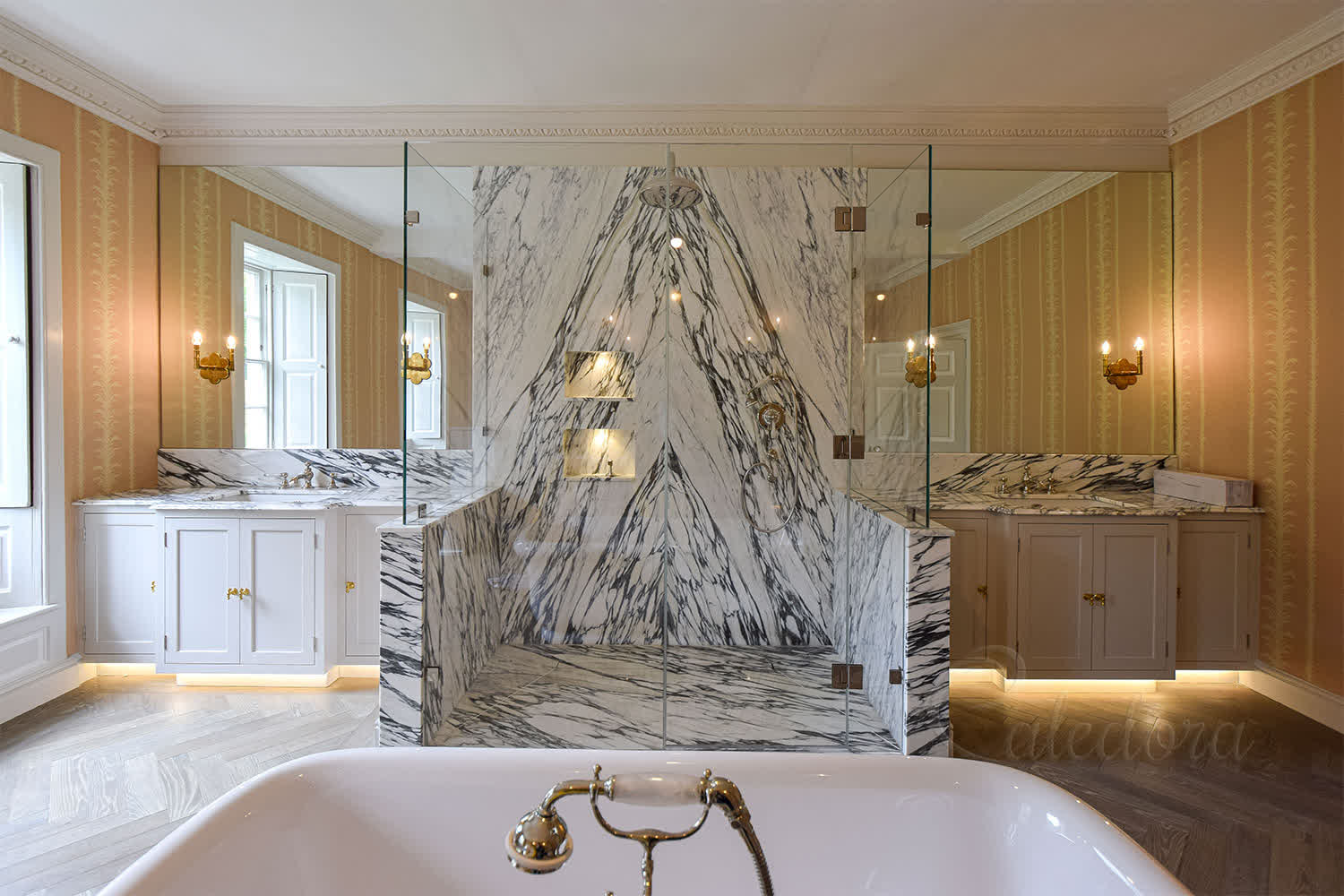 Frameless three-sided shower enclosure with Ultra Clear glass and stone walls