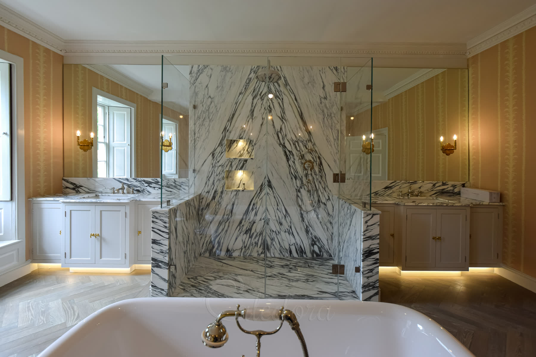 Frameless three-sided shower enclosure with Ultra Clear glass and stone walls