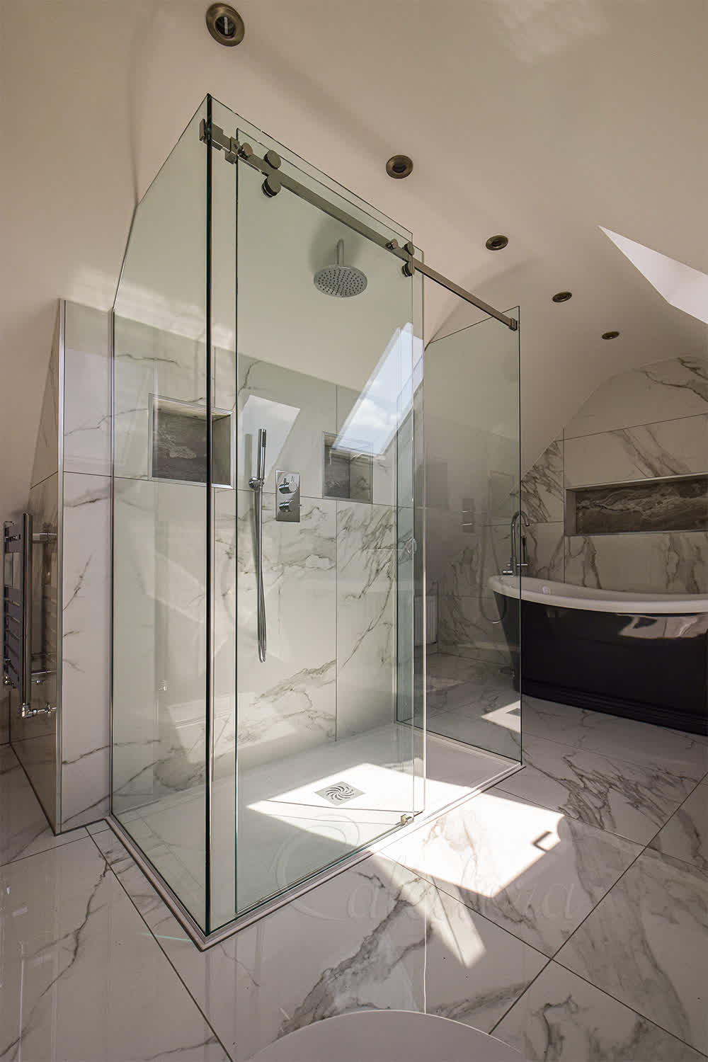 Three-sided shower enclosure with sliding door open seen from the left side