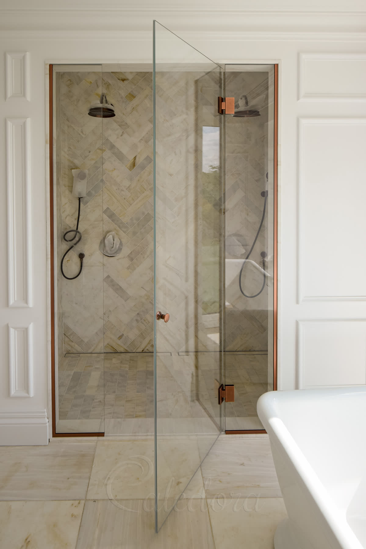 Front view of inline shower enclosure with door opened outwards, showing minimal seals and careful placement to avoid contact with bath