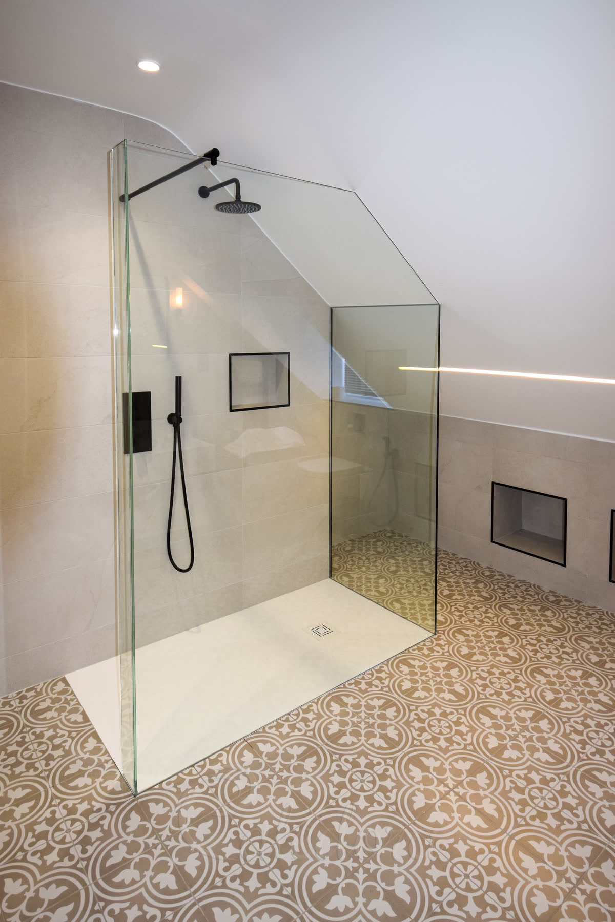 Walk-in angled L-shape shower screen with UV bonded panels and wall recessed fixing