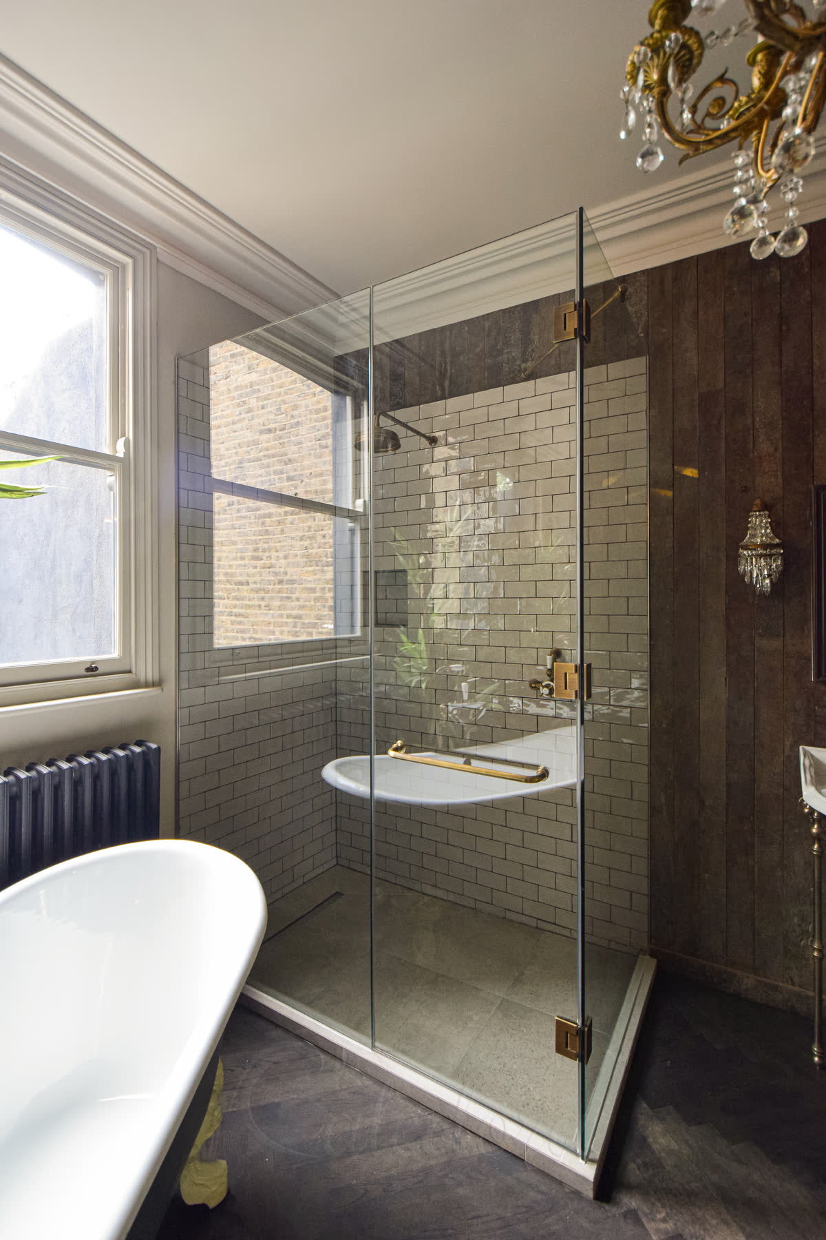 Shower door with towel rail demonstrating practical towel placement when door opens for user access