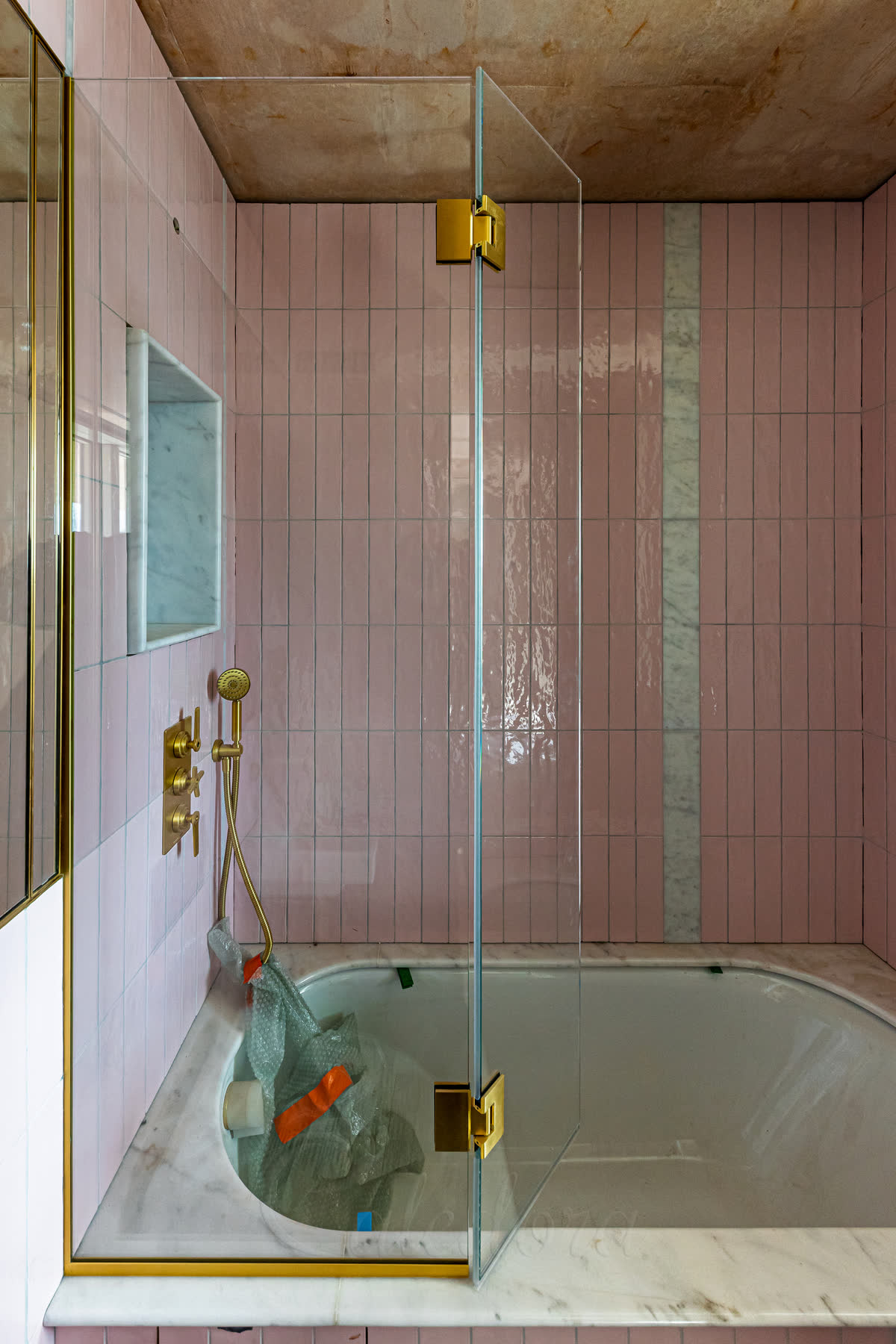 Bath screen with flipper panel showing 90 degree swing capability