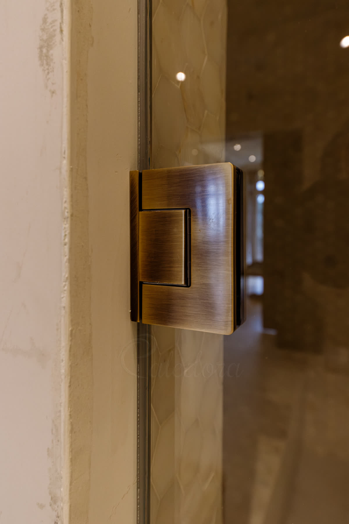 Antique Brass hinge close-up with neat, minimal door-edge seal