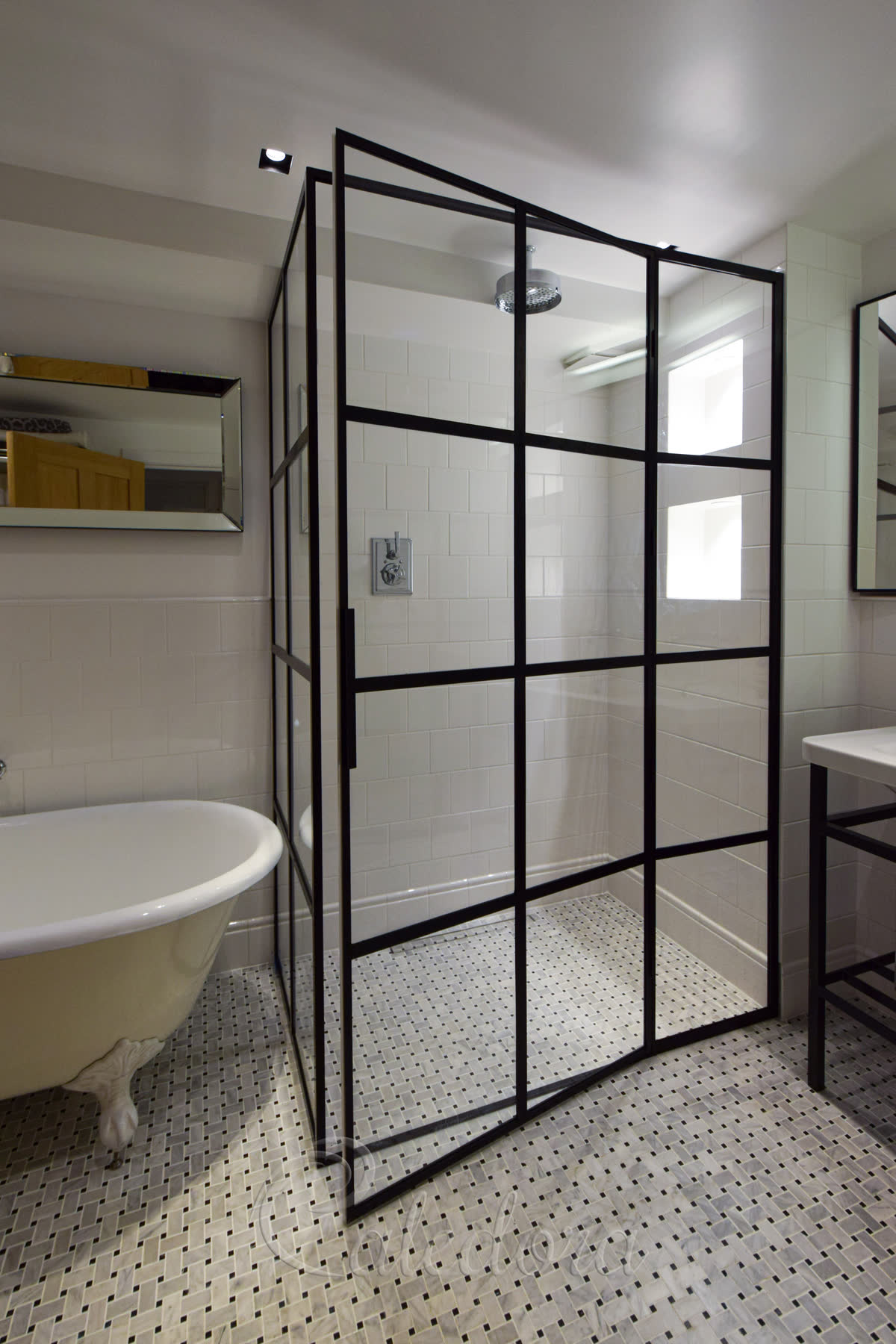 Toughened clear glass enclosure with hidden hinges and uniform framing