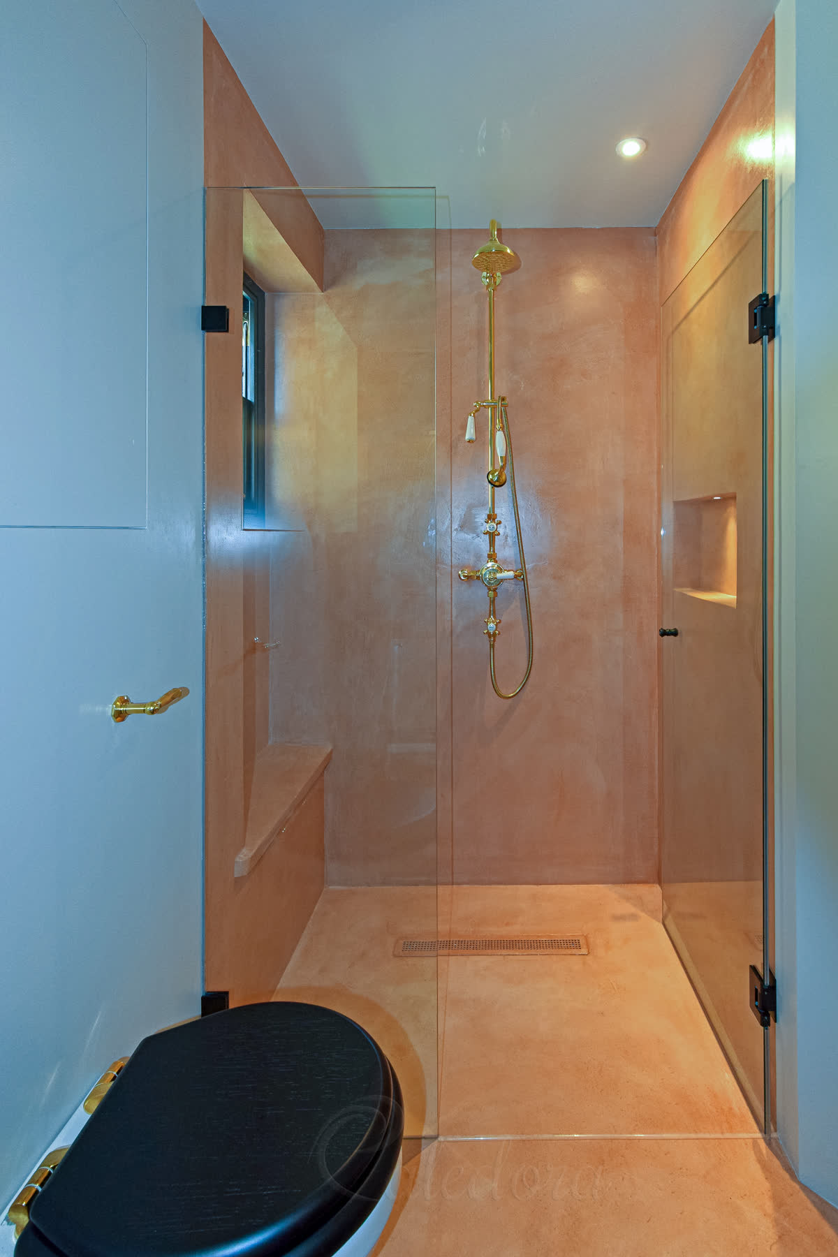 Fully opened shower door demonstrating dual-swing hinges against wall