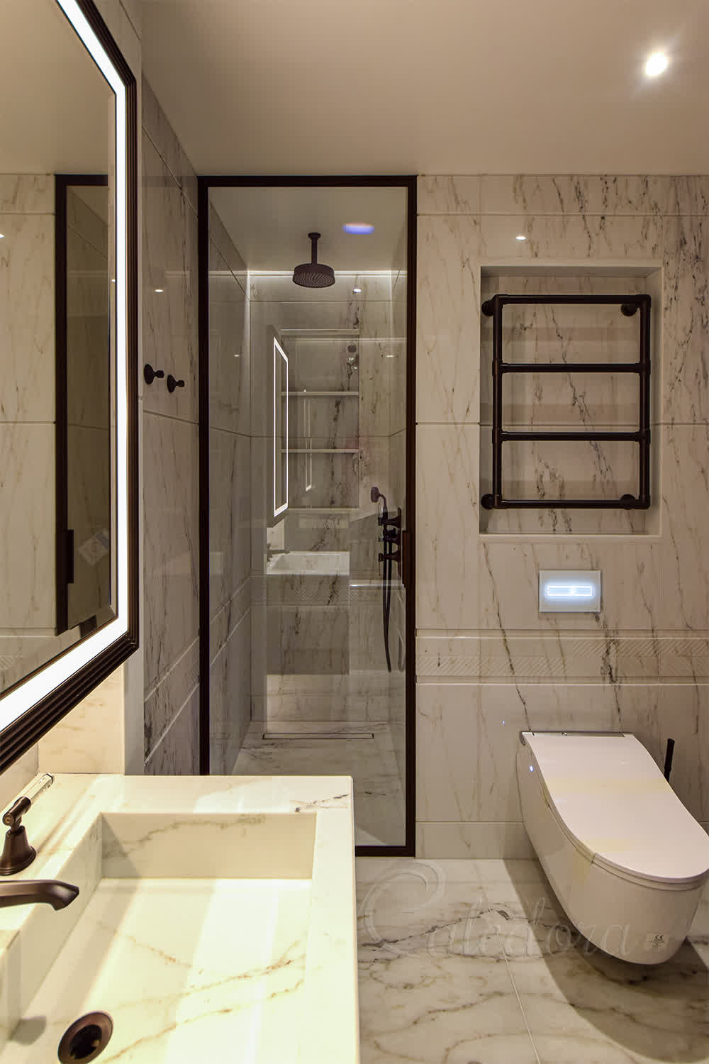 Bronze framed shower door with ultra clear glass in marble bathroom