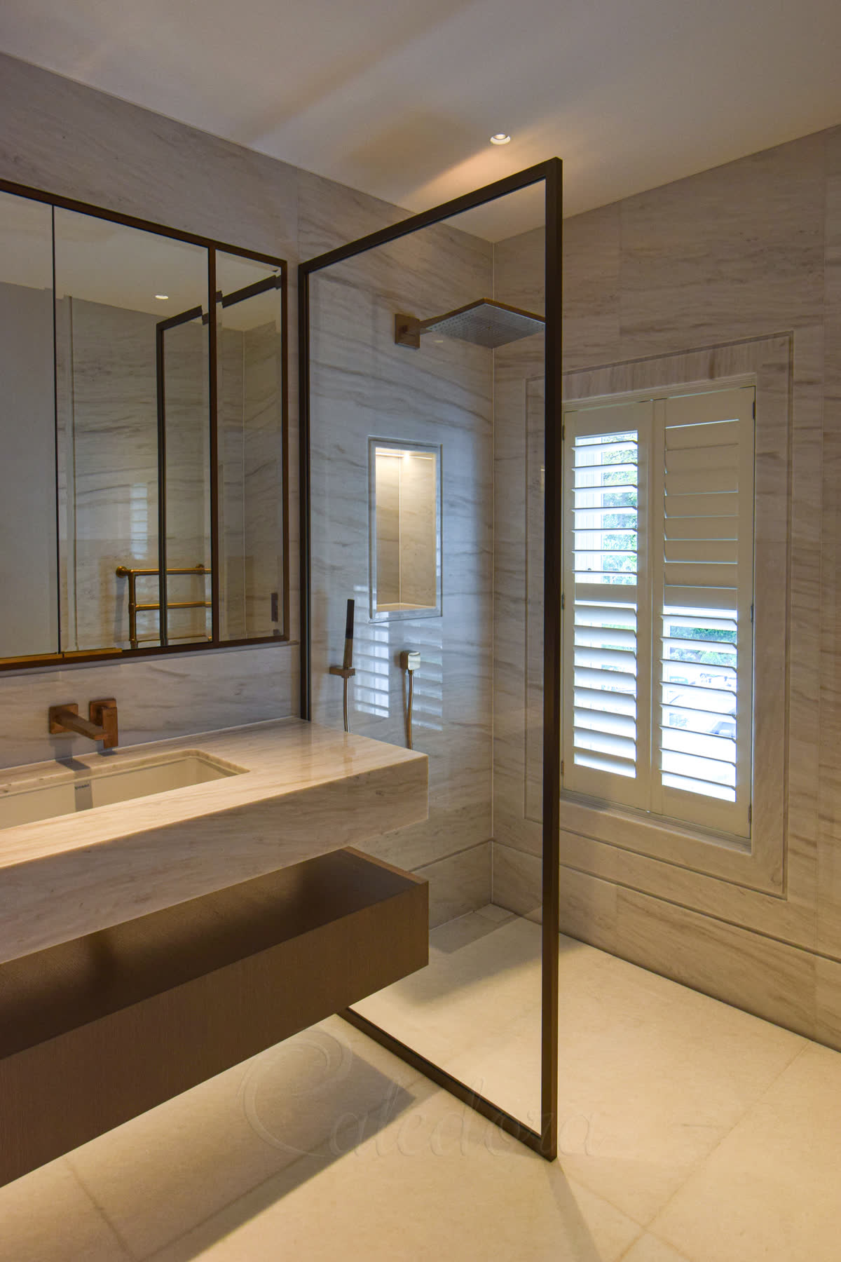 Fixed bronze shower screen with anodised frame and ultra clear glass