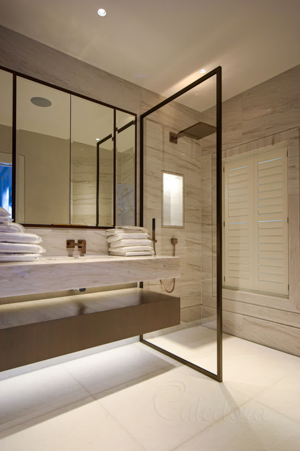 Walk-in shower screen with bronze framing and Ultra clear glass