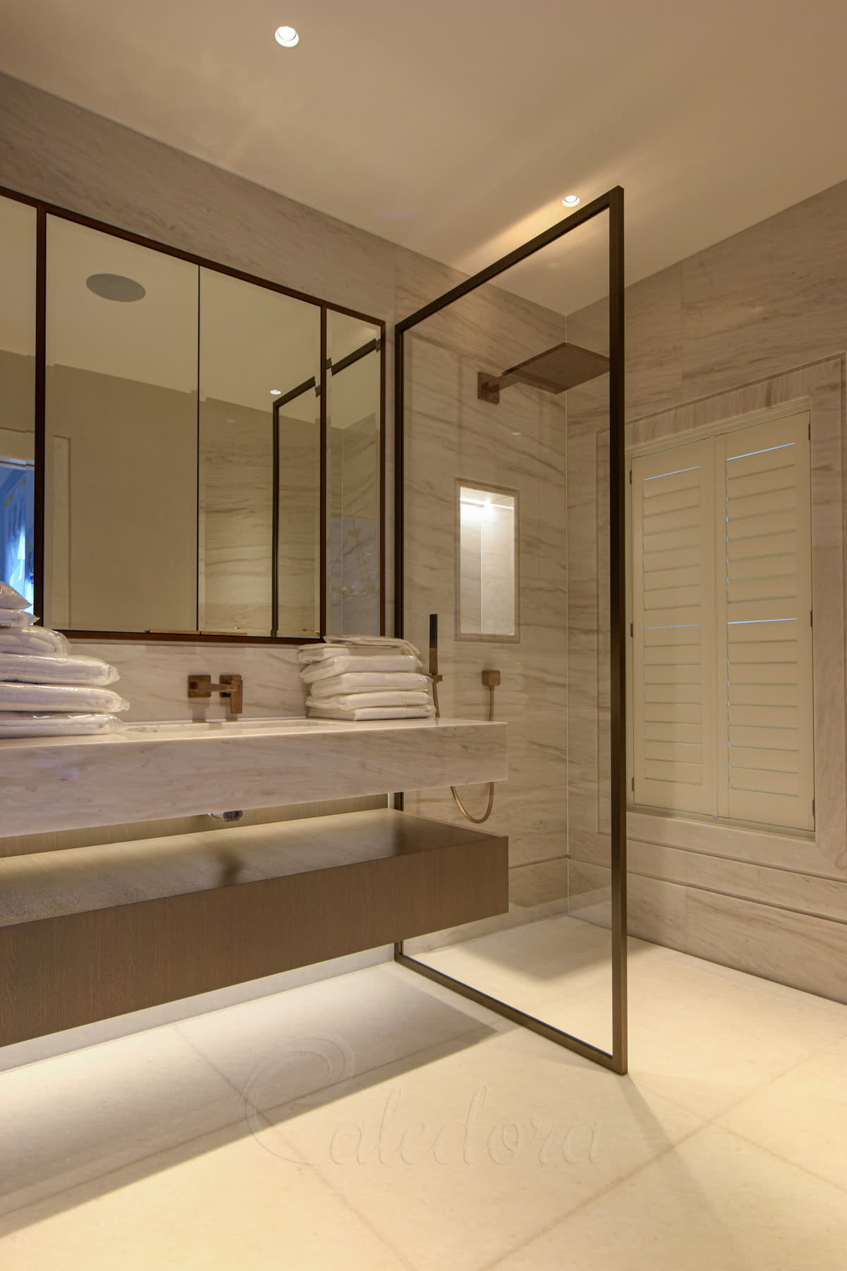 Walk-in shower screen with bronze framing and Ultra clear glass