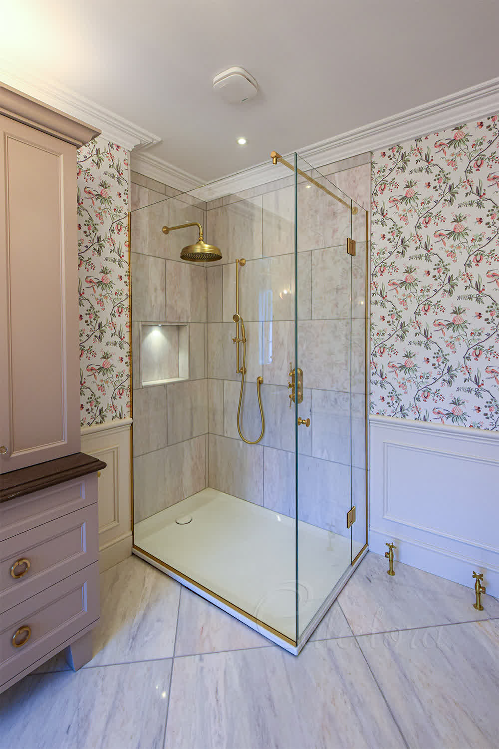 Frameless brushed brass corner shower enclosure with Ultra Clear glass and swing door