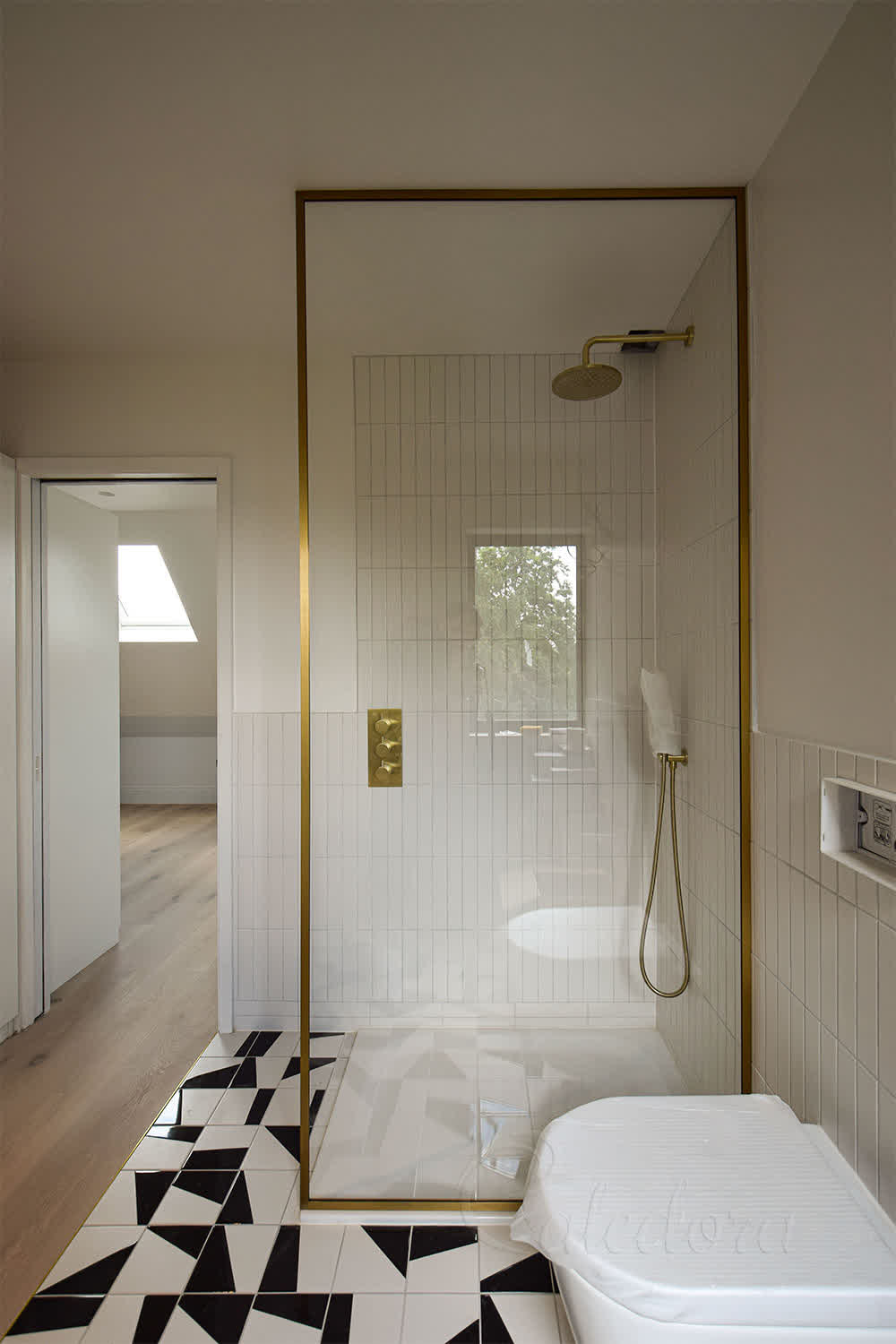 Brushed Brass framed shower screen with ultra clear glass in London bathroom