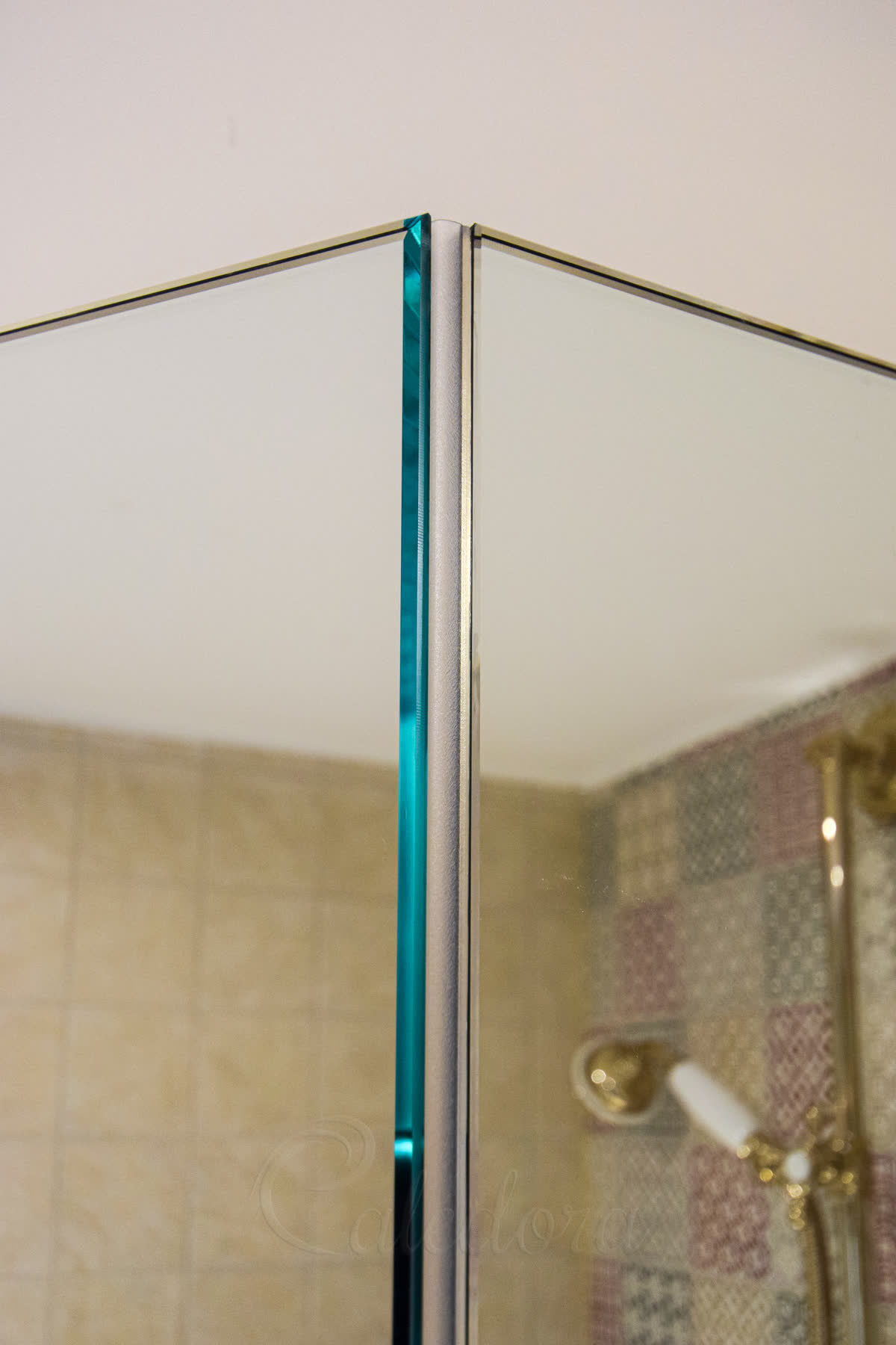 Polished glass edge detail showing minimalistic seals on diamond enclosure