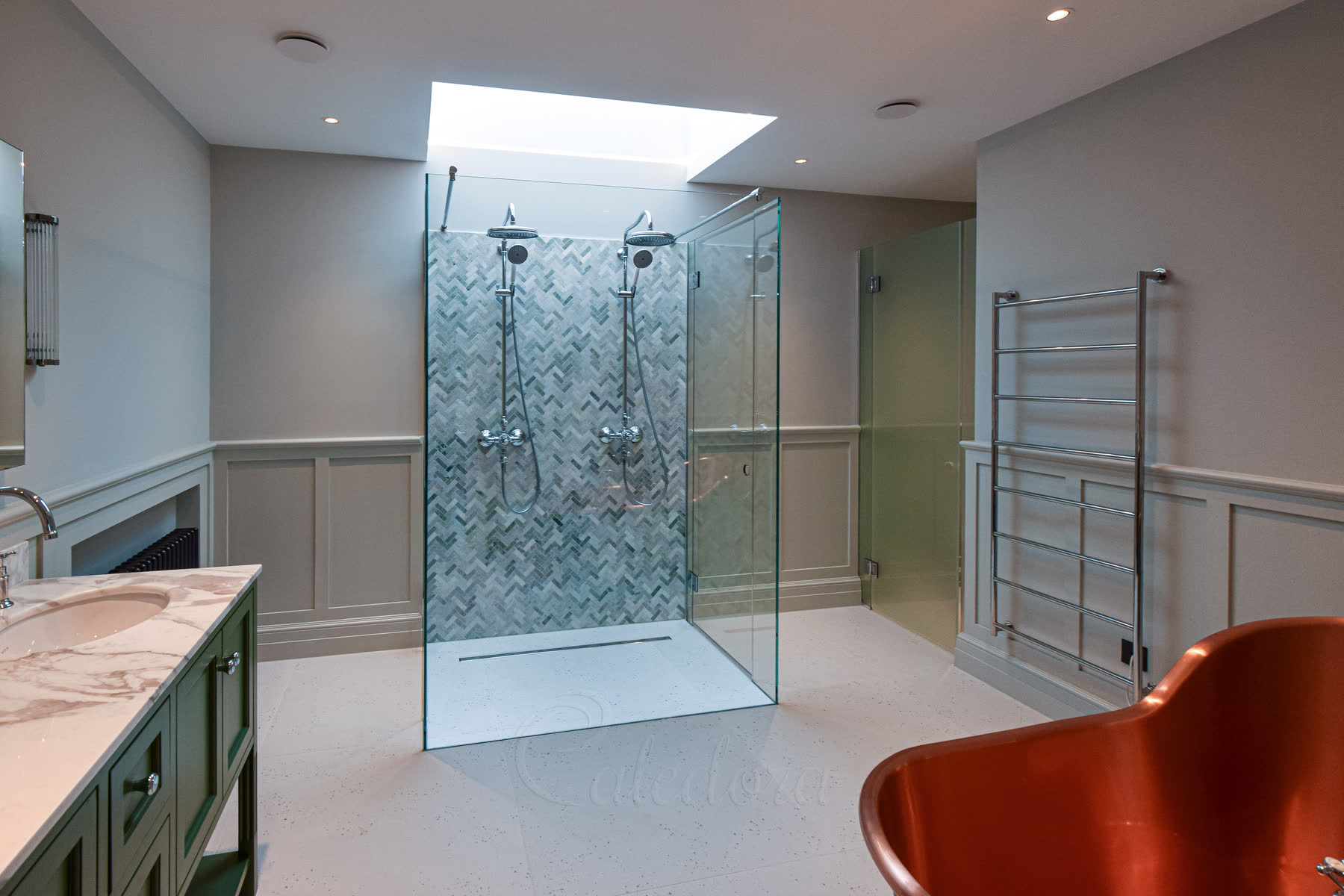 Three-sided double shower enclosure with both doors closed and polished chrome fittings