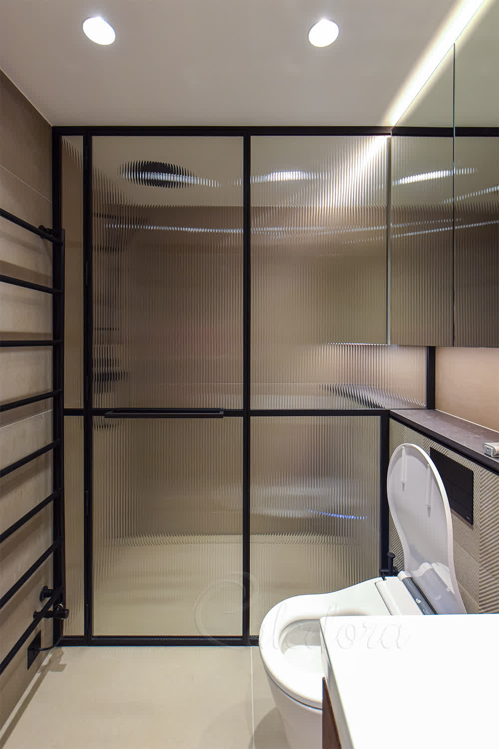 Fluted glass shower enclosure with satin black frame in modern bathroom