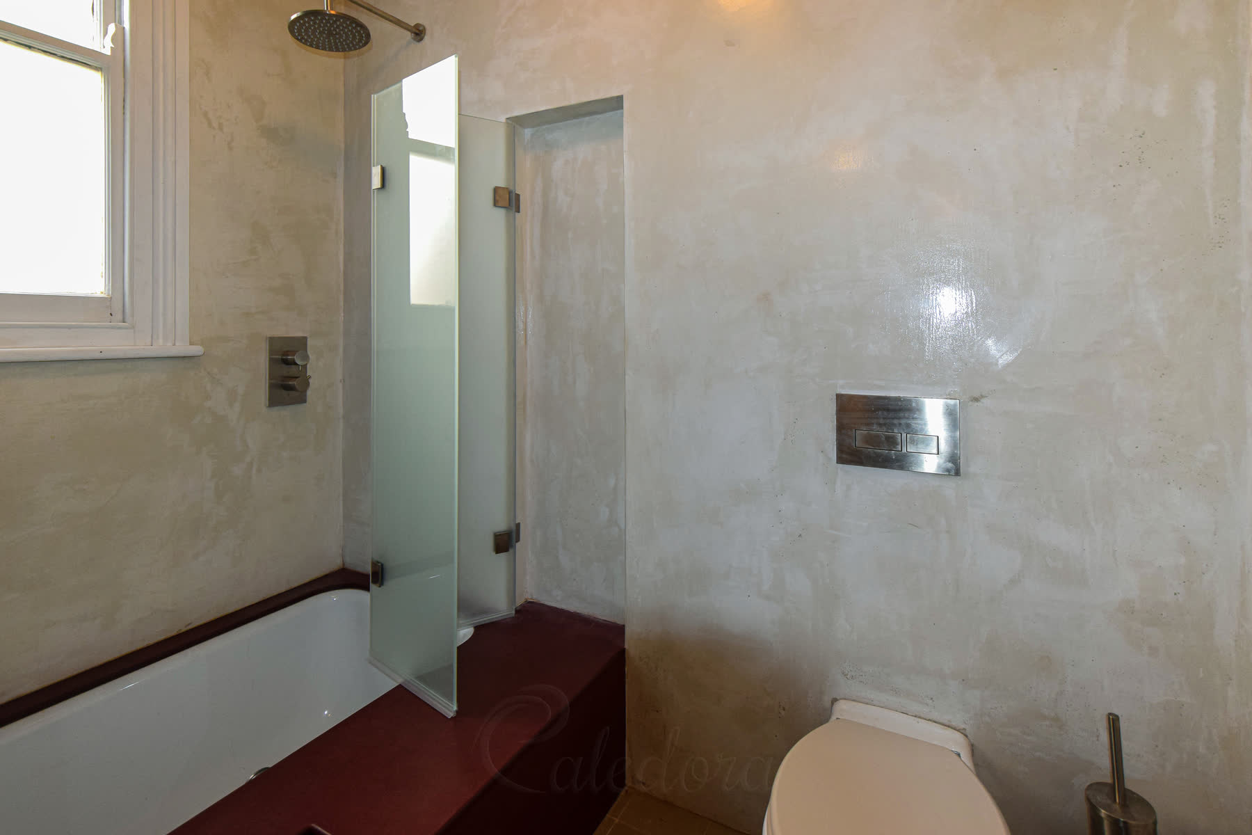 Side view of the folding shower screen showing how it sits flush with the bathroom wall