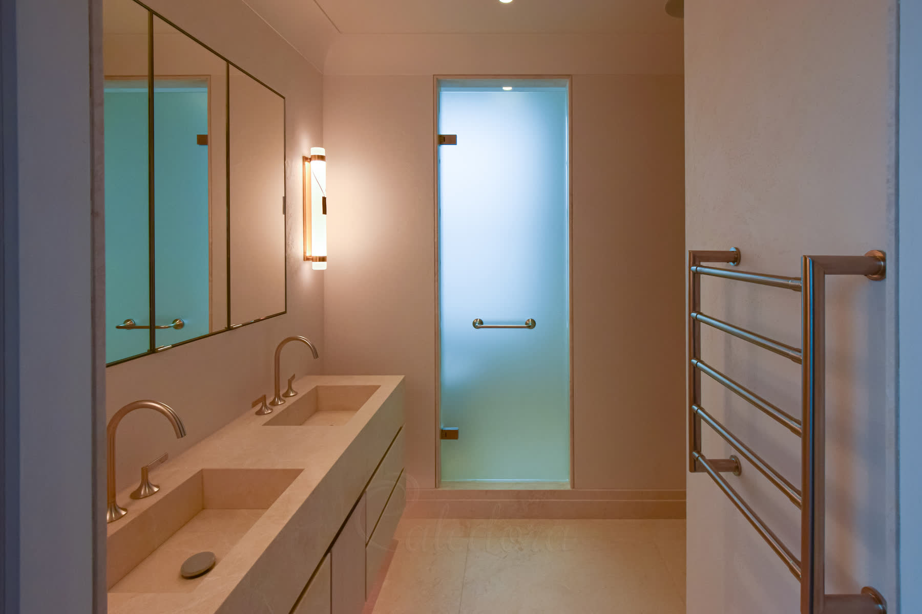 Luxury frosted glass shower doors and WC entrance with brushed stainless hardware mounted on natural stone