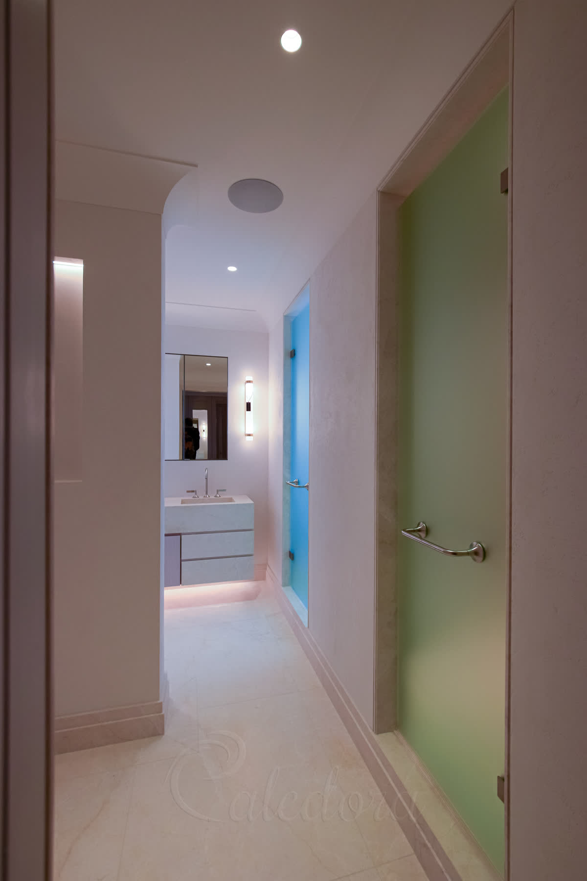 Brushed stainless hinge mounted directly on stone frame for frosted glass shower door