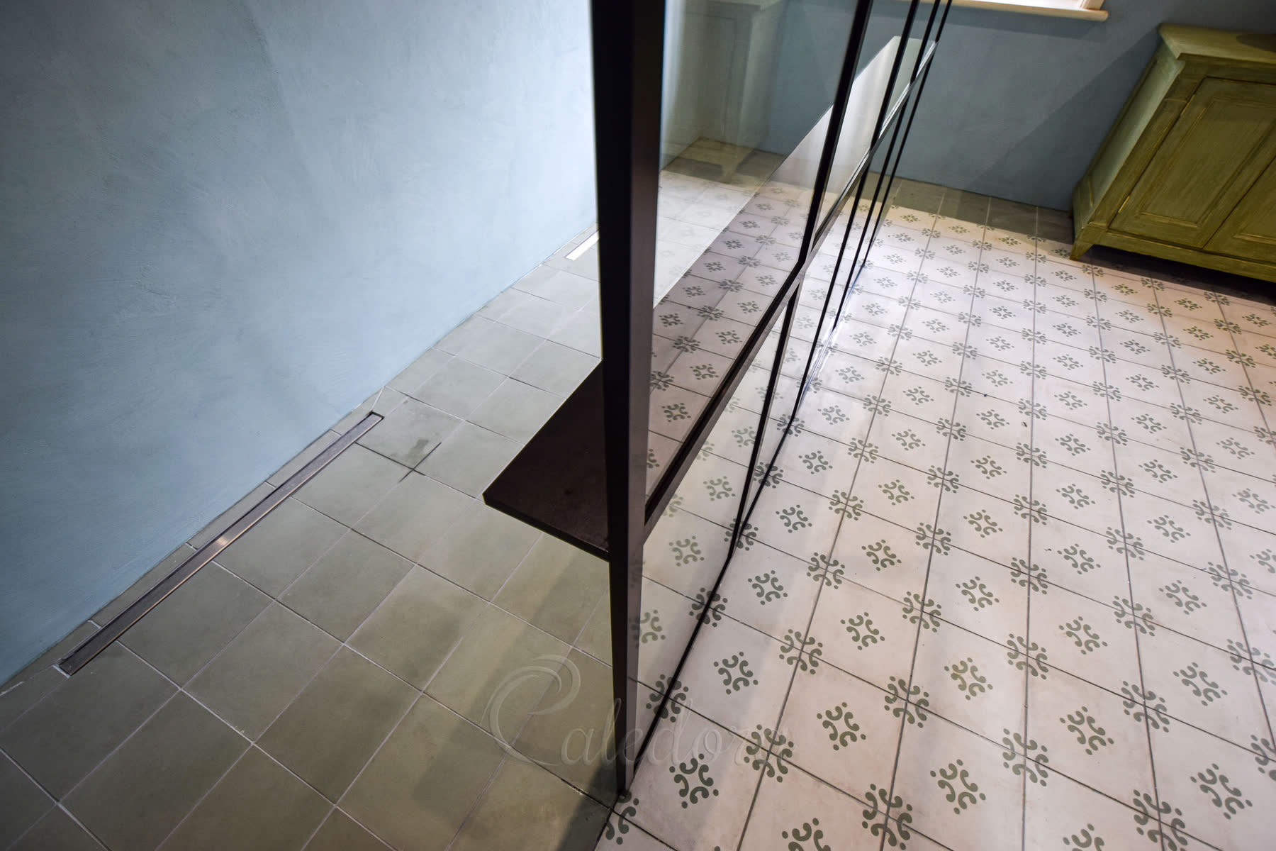 Black grid walk-in shower screen with integrated shelf in Lewes, showing dual shower heads and shower-to-dressing-zone division