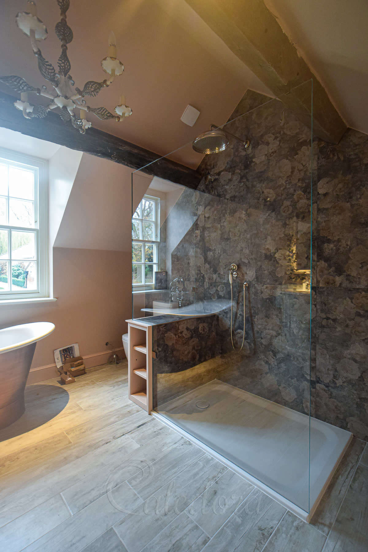 Side view showing how the shower screen fits perfectly in the loft bathroom space