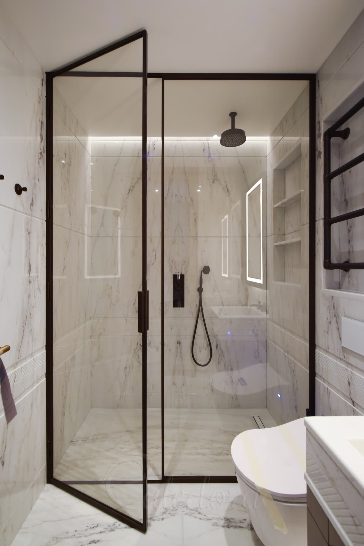 Large bronze framed shower enclosure with ultra clear glass and swing door