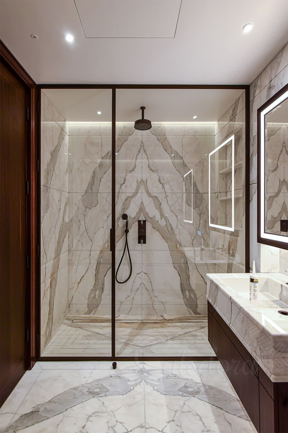 Large bronze framed shower enclosures with ultra clear glass and swing doors