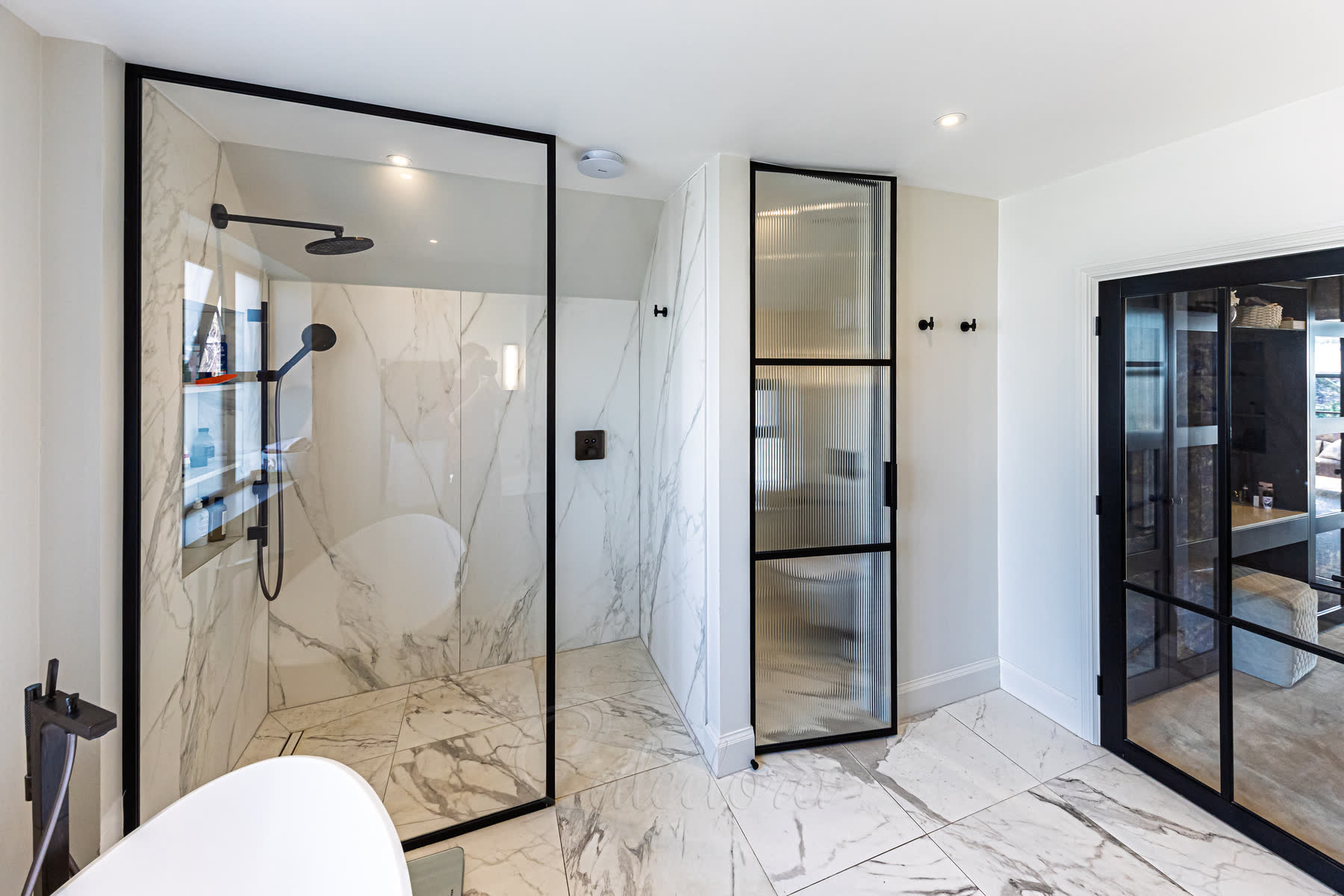 Complete bathroom view showing matt black shower screen with matching door and coordinated black fixtures throughout