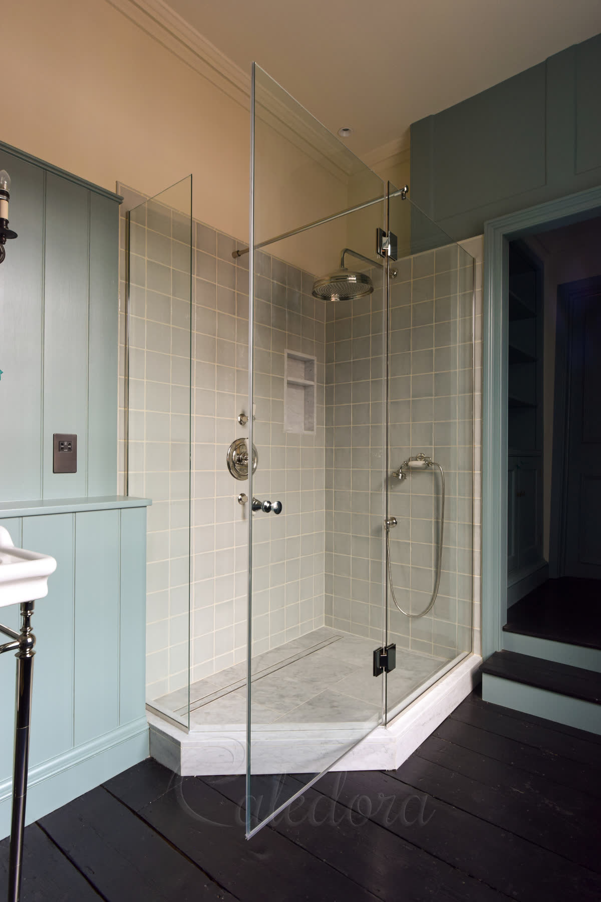 Pentagon shower enclosure with nickel hinges and timber wall panels in Basingstoke