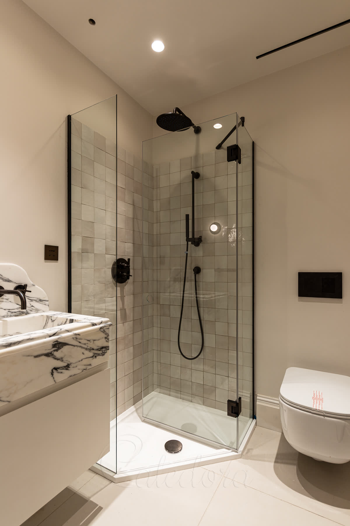 Pentagon shower enclosure gunmetal finish detail with bespoke PVD coating and circular handle