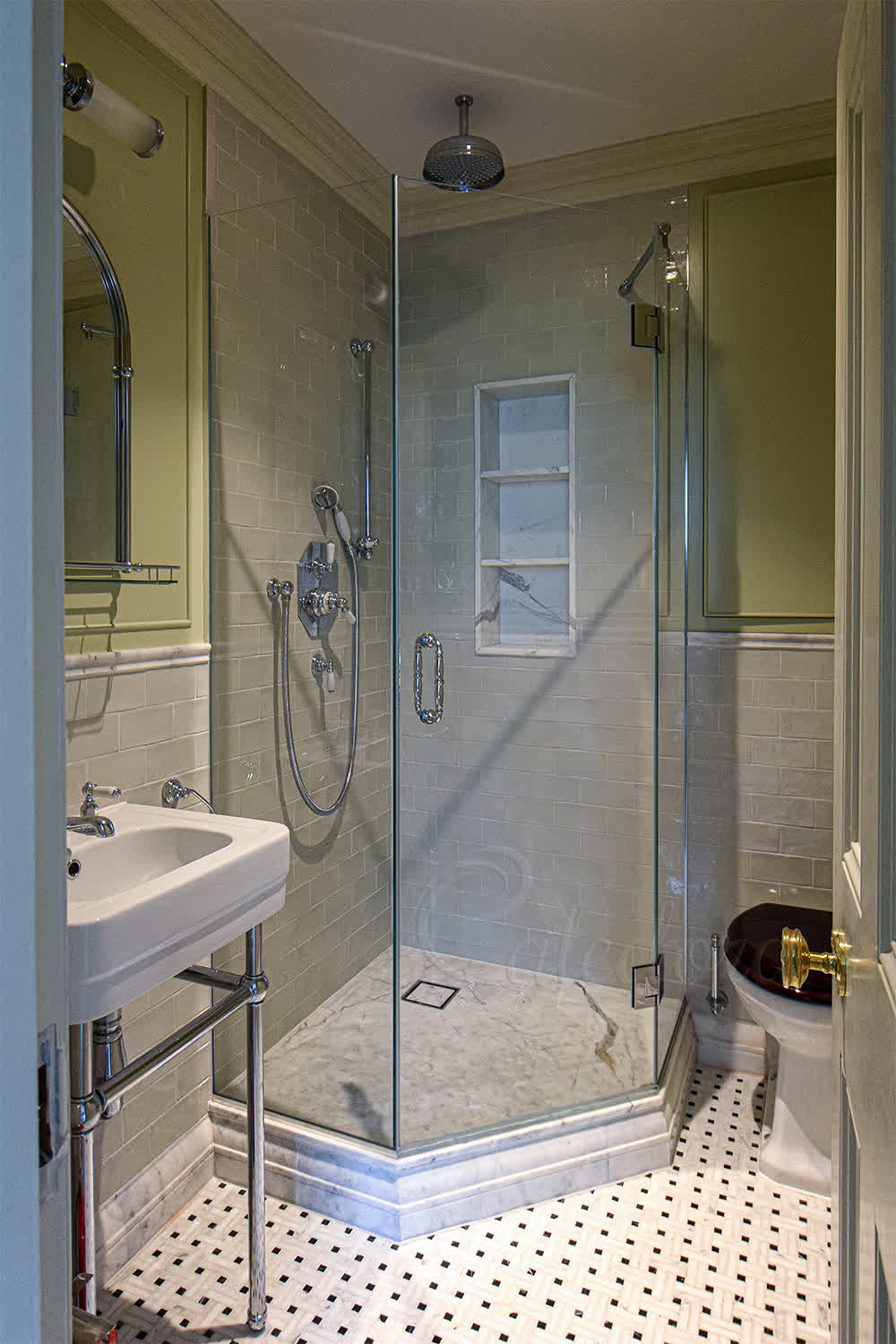 Pentagonal shower enclosure with chrome fixtures in small Farnham bathroom