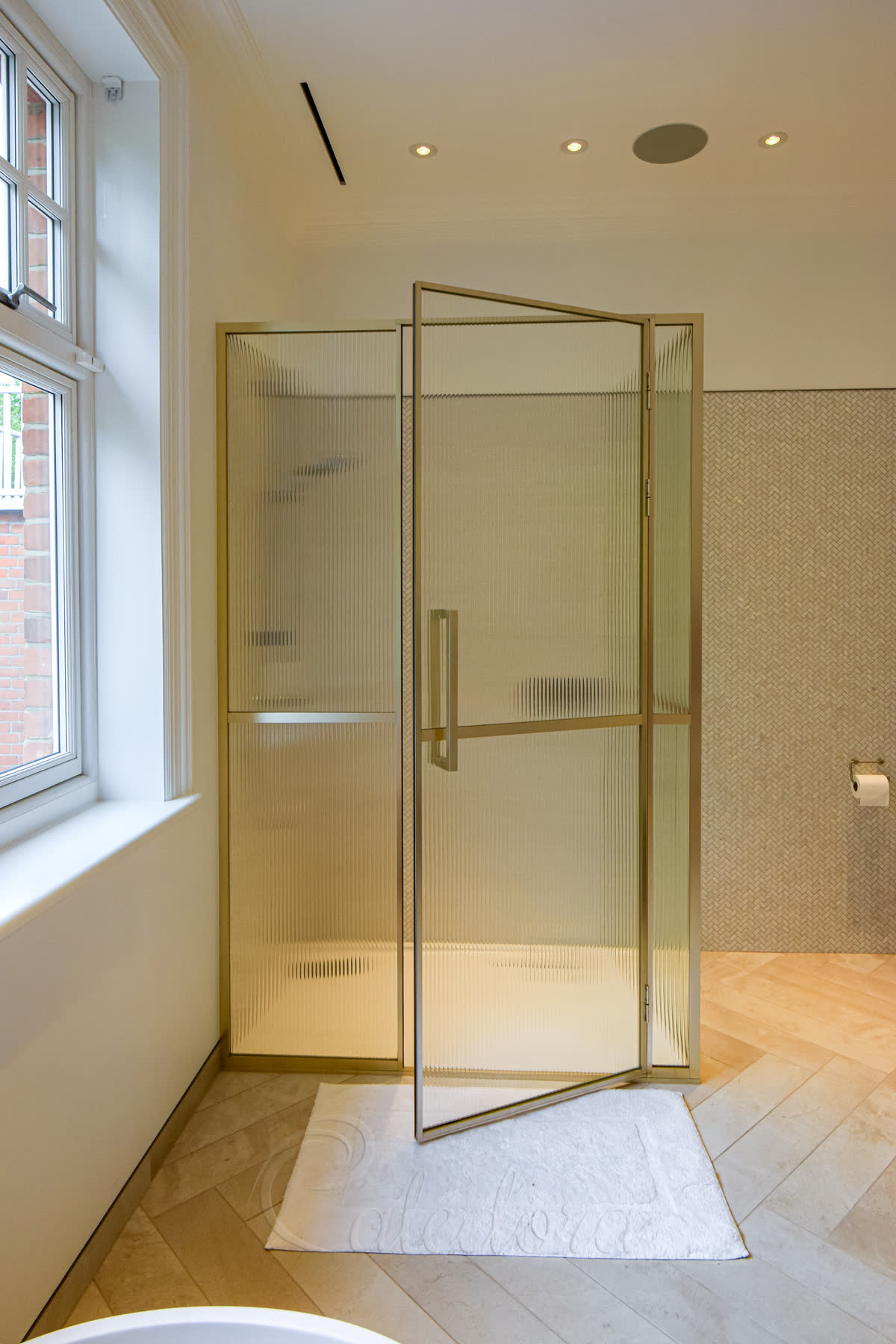 Front view of rectangular shower enclosure with door partially open