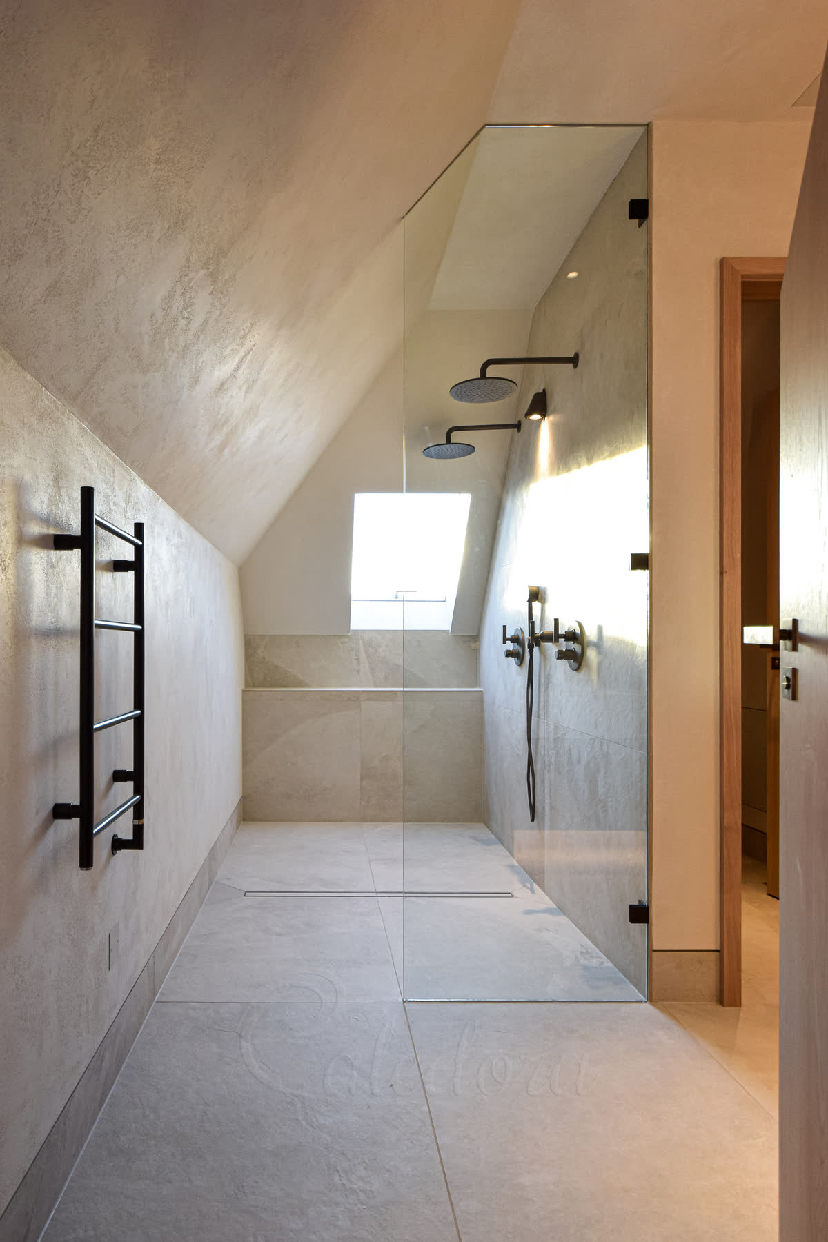 Narrow shower screen showing why minimum width matters for water protection