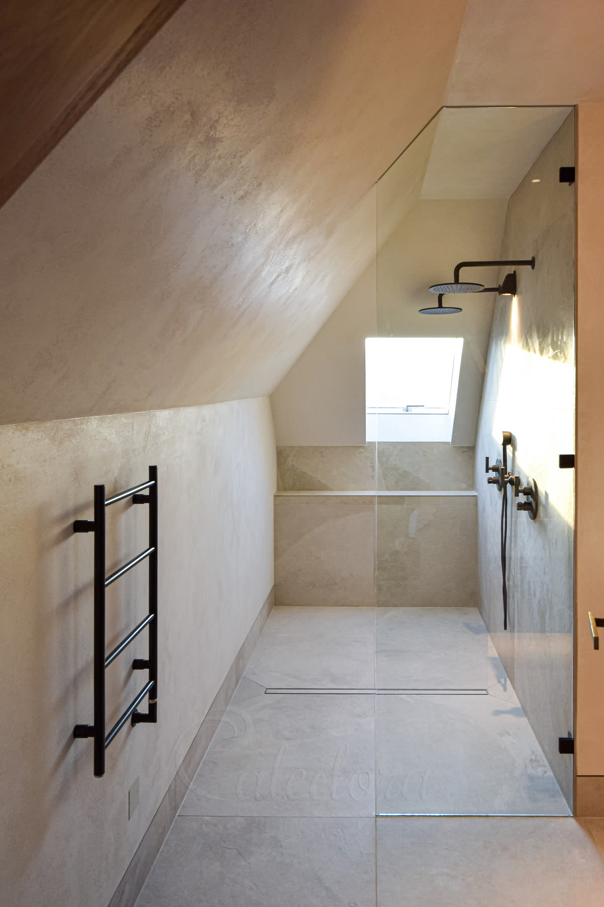 Small shower screen London with narrow glass panel under sloped ceiling