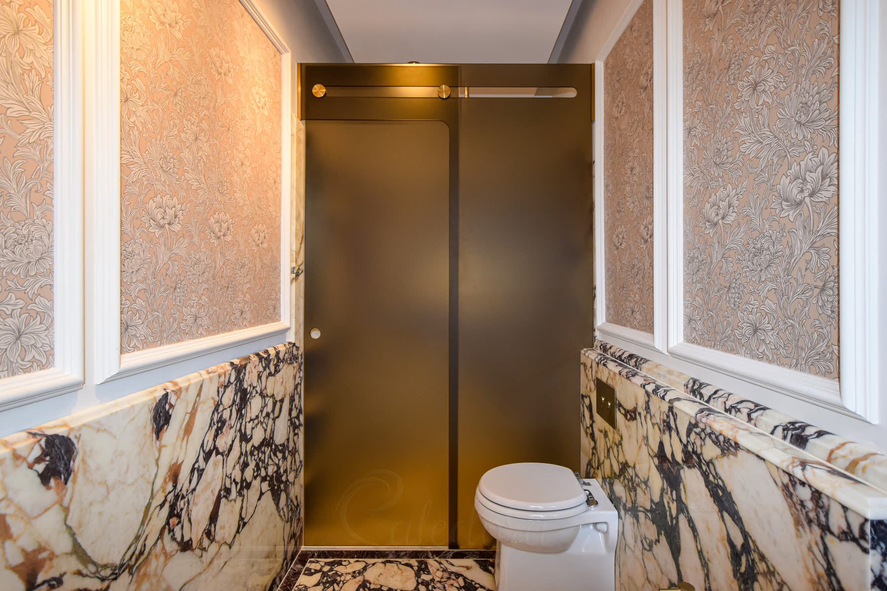 Bronze frosted glass sliding door with sandblasted texture for privacy in luxury marble bathroom