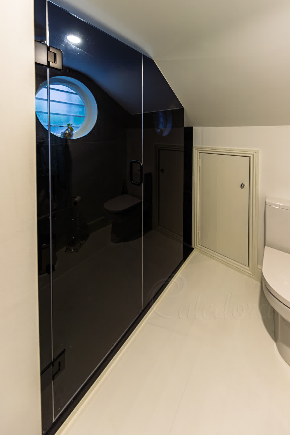 Tinted shower enclosure with grey glass mirror effect