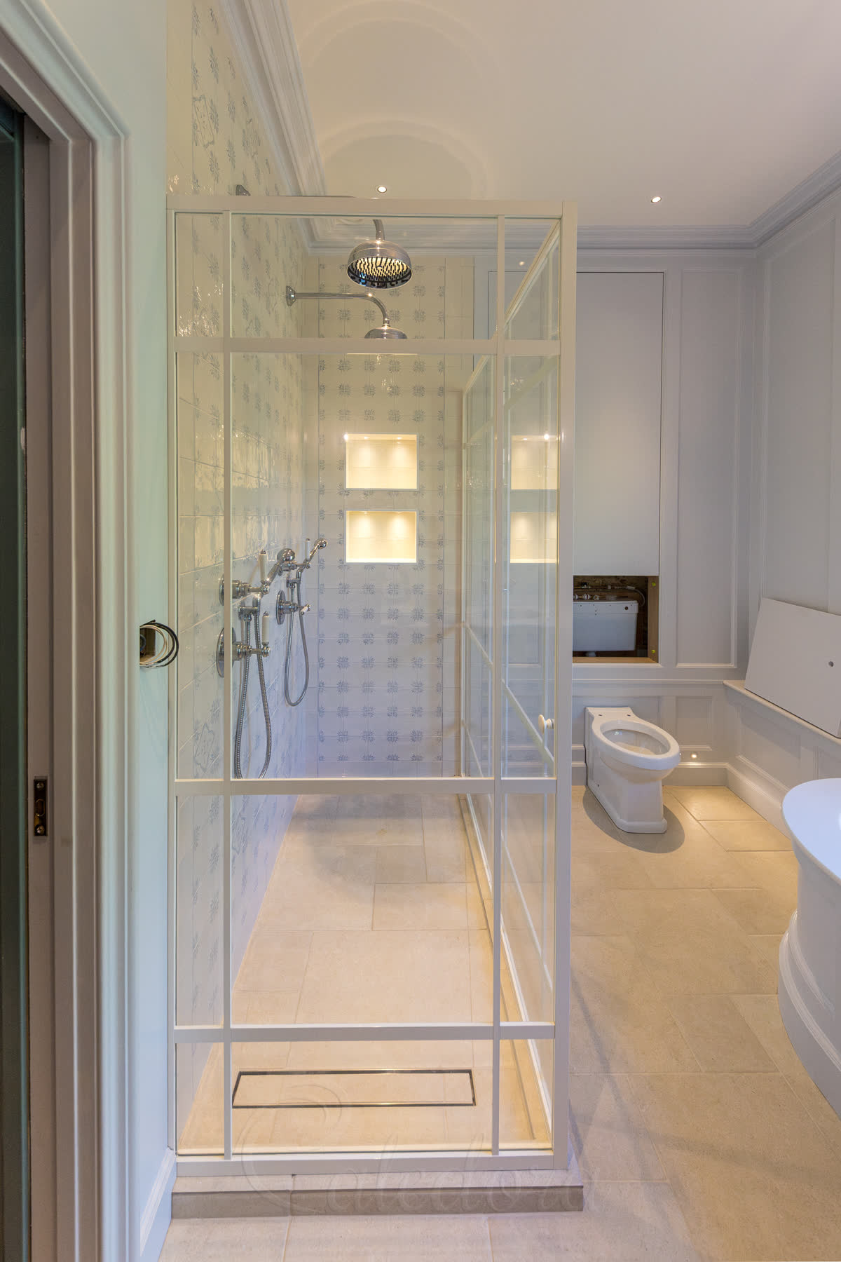 Matching grid-style pattern on both sides of white shower enclosure door