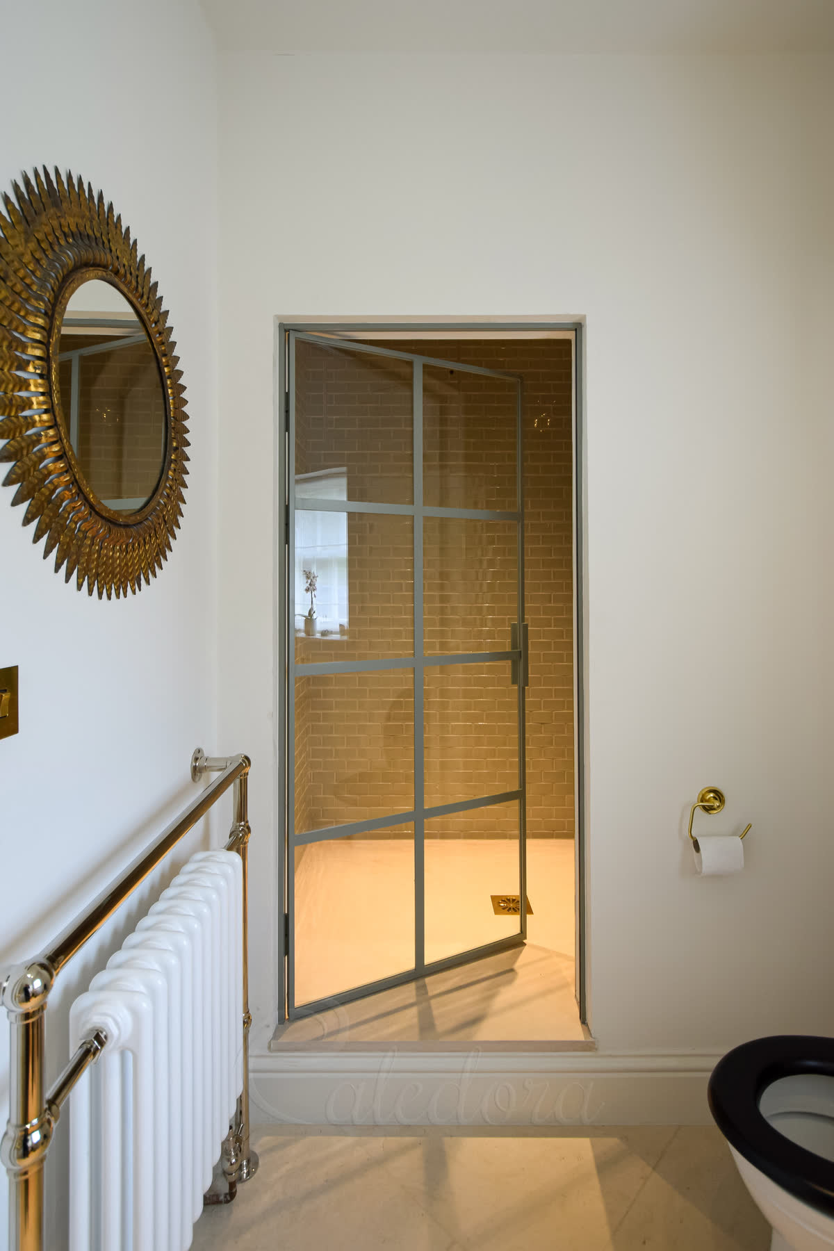 Bespoke light grey framed shower door with grid pattern, partially open, 8mm ultra clear glass with custom powder-coated metal framework