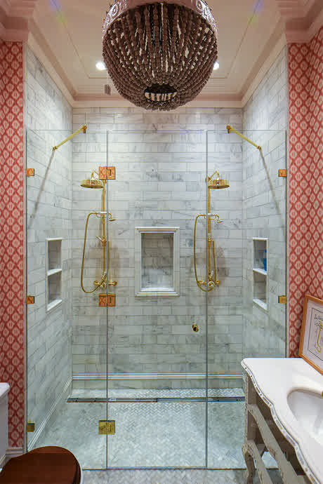 bespoke shower door with brass hinges and two fixed screens