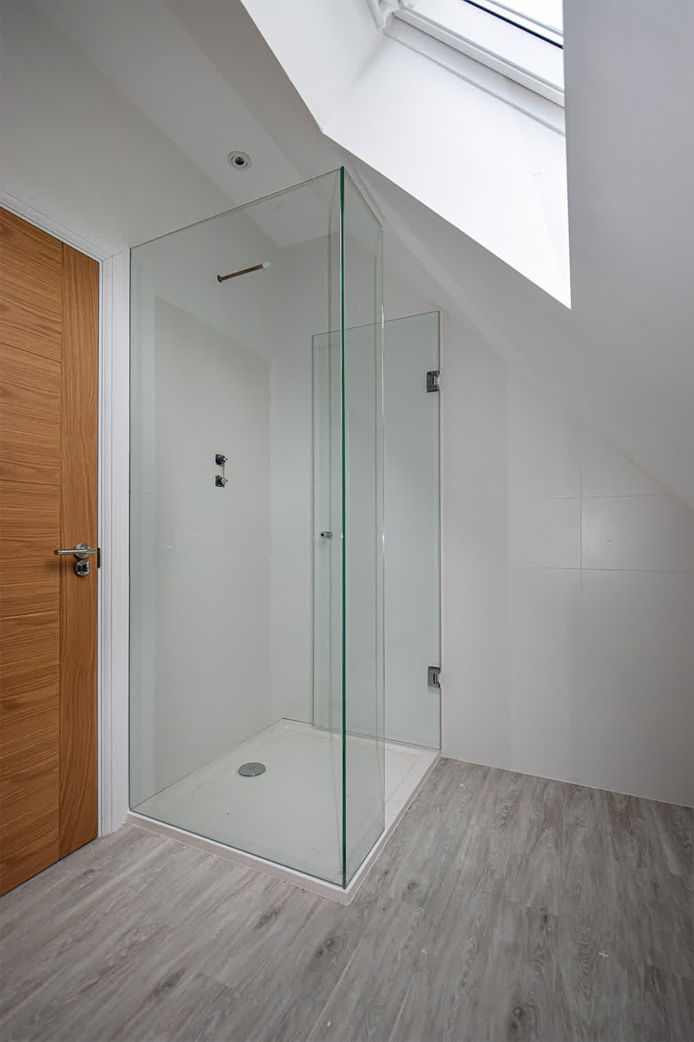 frameless shower enclosure opened door