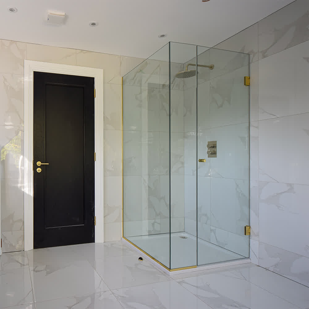 Hinged shower enclosure with U-channels on walls