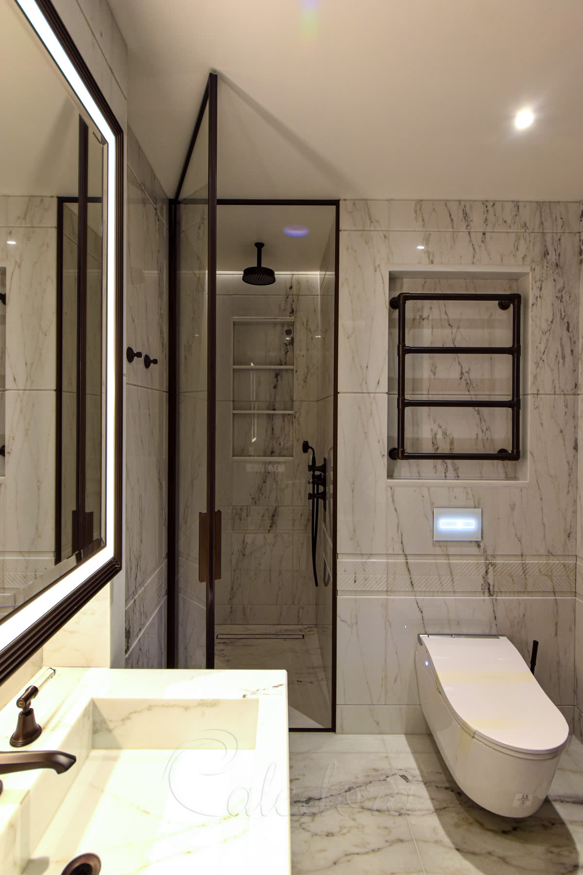 Framed hinged glass shower door with bronze frame, minimalistic hinges, laminated toughened safety glass in luxury marble bathroom