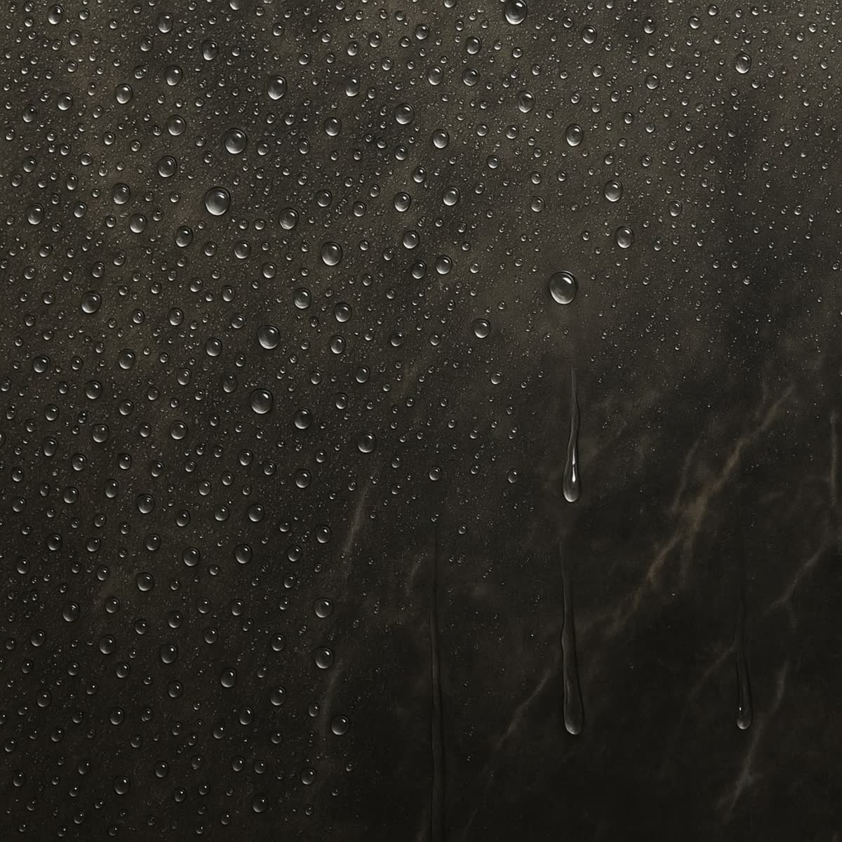 Water droplets beading on glass with hydrophobic easy-clean coating, demonstrating water repellent properties