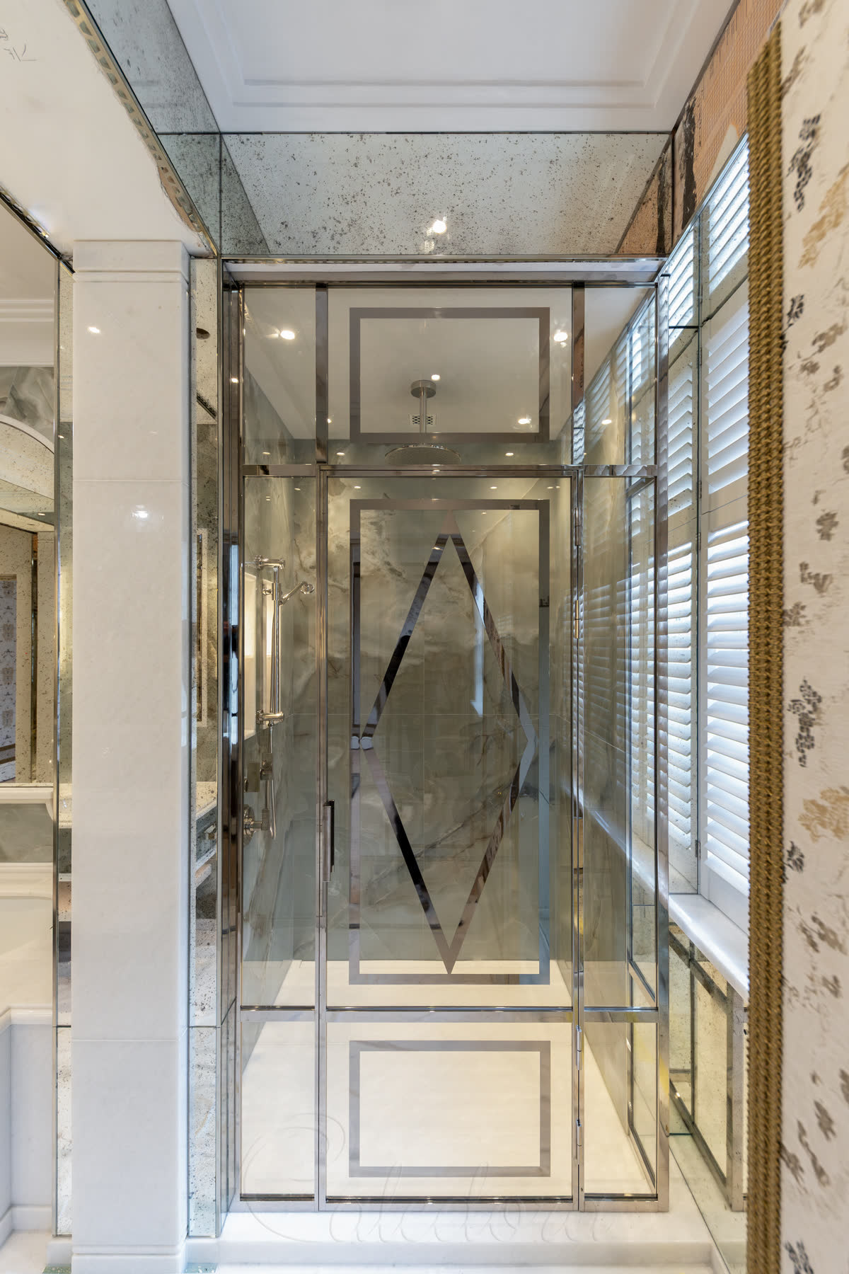 Inline shower enclosure with decorative metal pattern laminated inside glass, polished nickel frame